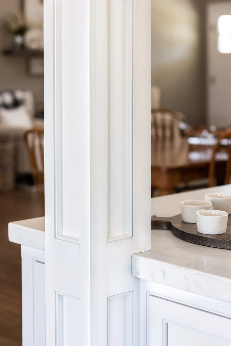 Transitional Country Cottage style kitchen with custom painted recessed panel wood column