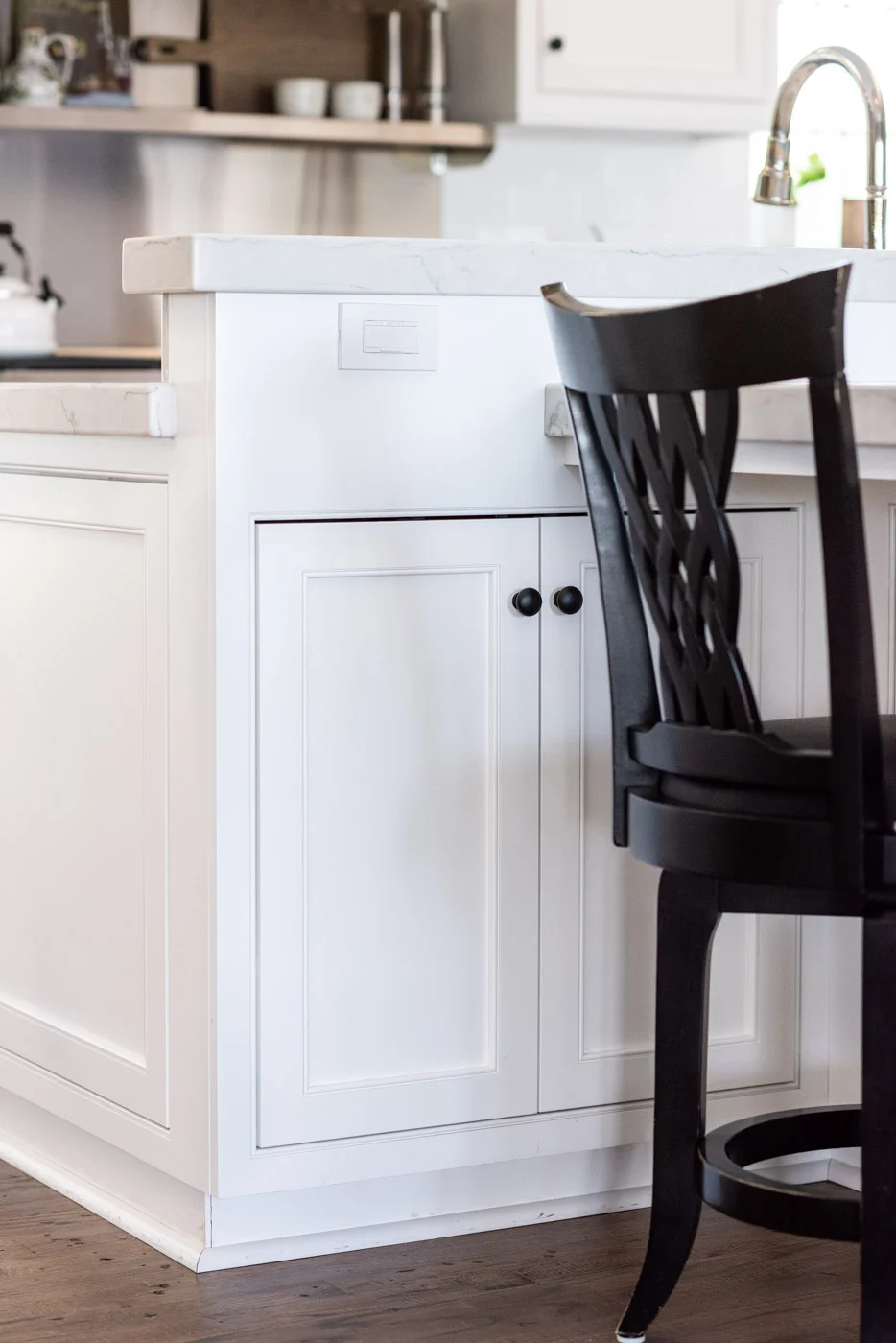 Transitional Country Cottage style kitchen with white recessed panel painted cabinets and island storage