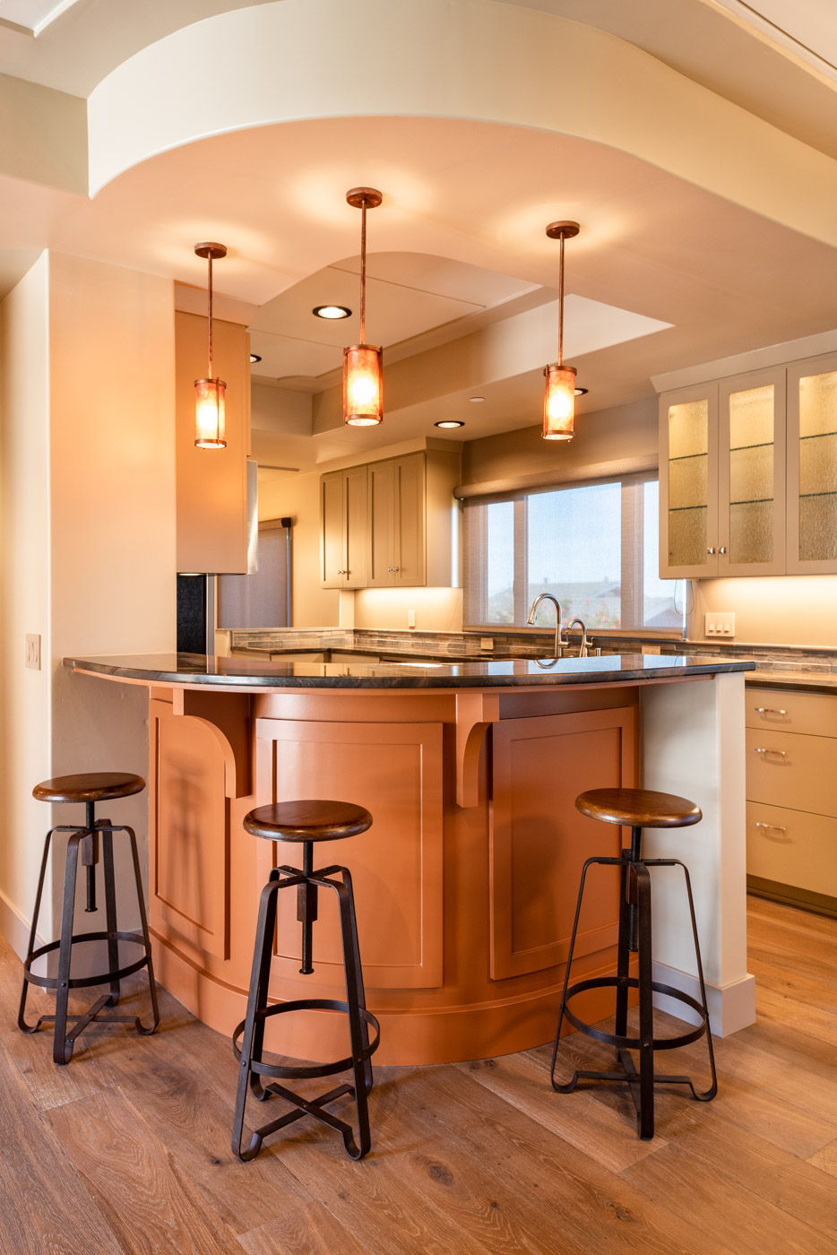 Craftsman style kitchen with custom painted shaker style cabinets and accent bar seating