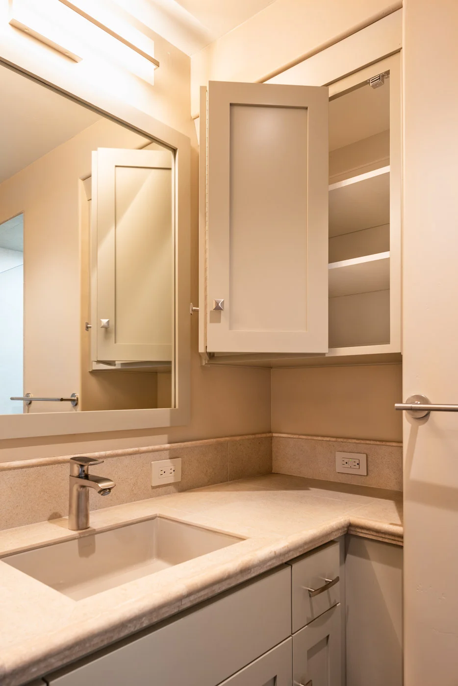 Craftsman bathroom vanity with custom painted shaker style cabinets and medicine cabinet storage