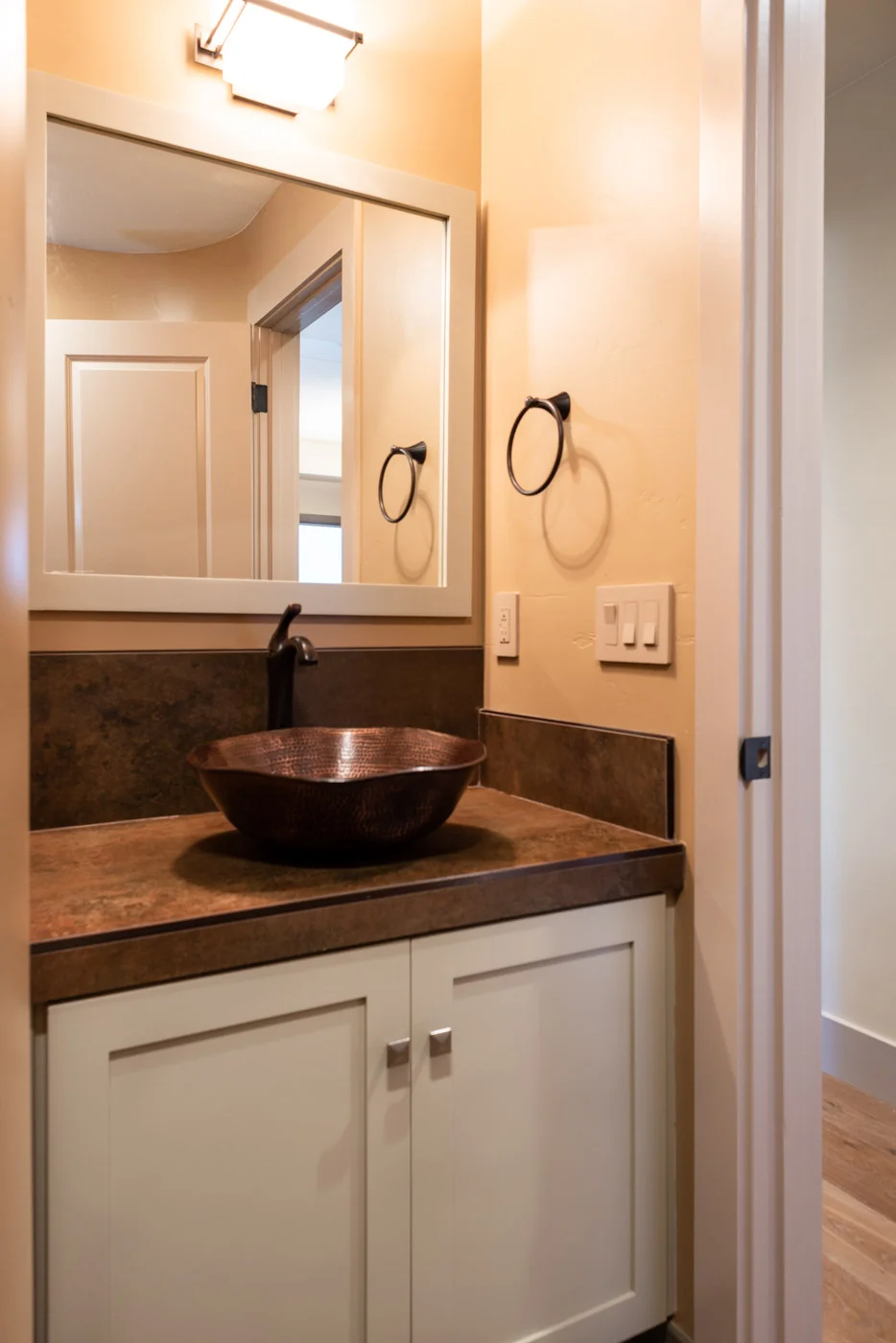 Craftsman bathroom vanity with custom painted shaker style cabinets