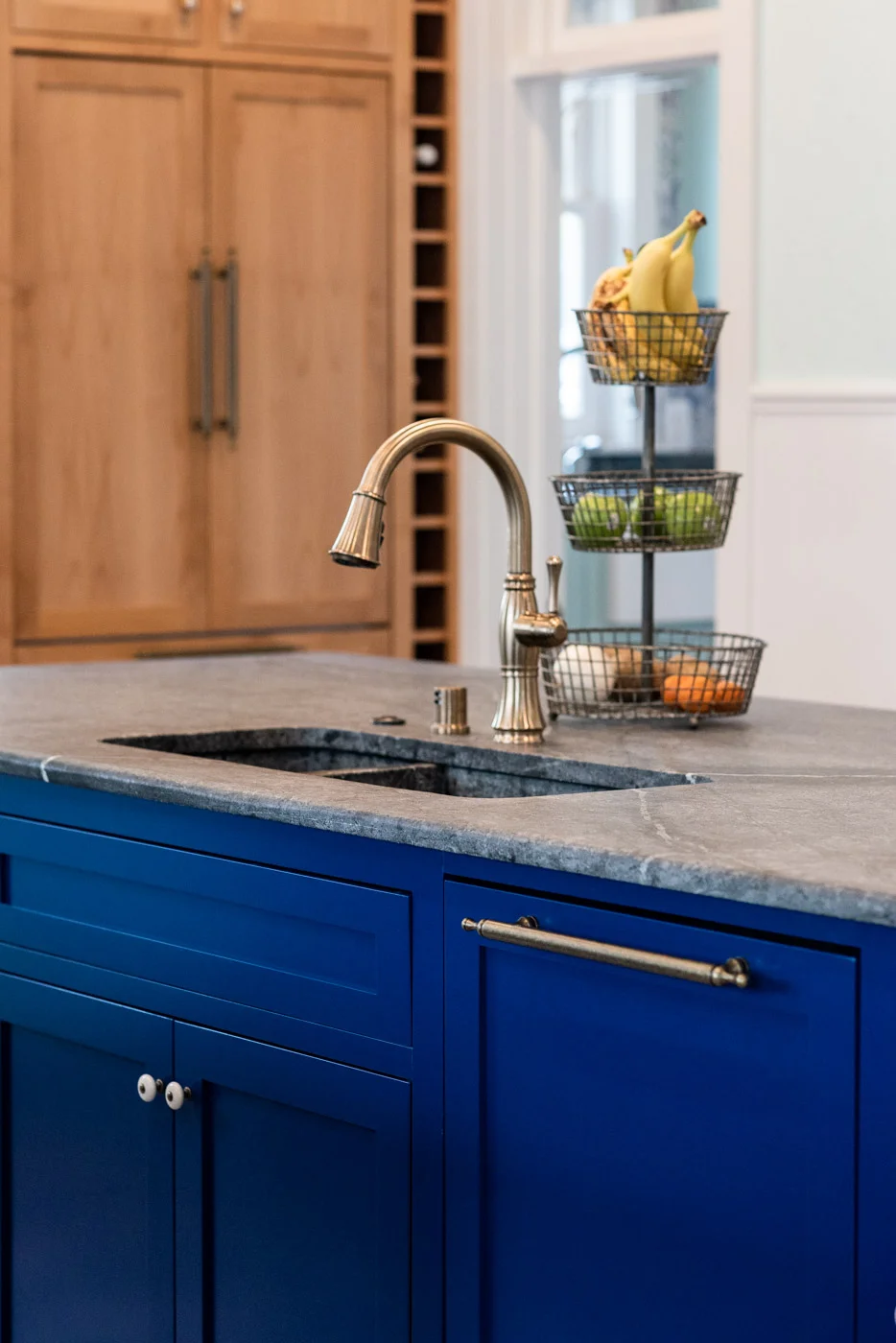 Eclectic Country Craftsman kitchen with custom blue painted cabinets and kitchen island sink