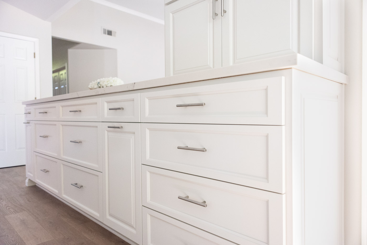 Modern White Kitchen Cabinets With Polished Nickel Hardware for Large Space