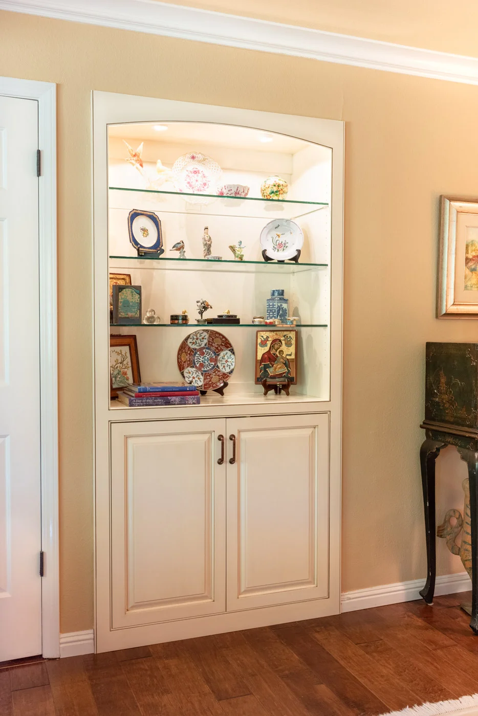 English Country Home custom living room built-in cabinet with glass display shelves