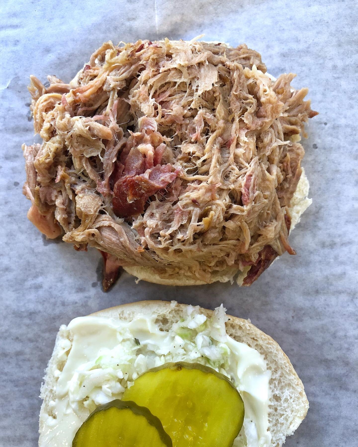 Our classic pulled pork sandwich is topped with mayo, vinegar slaw, and pickle🤤
#jjsbarbecueofcolumbia 
#votedbestbarbecue
#yummy