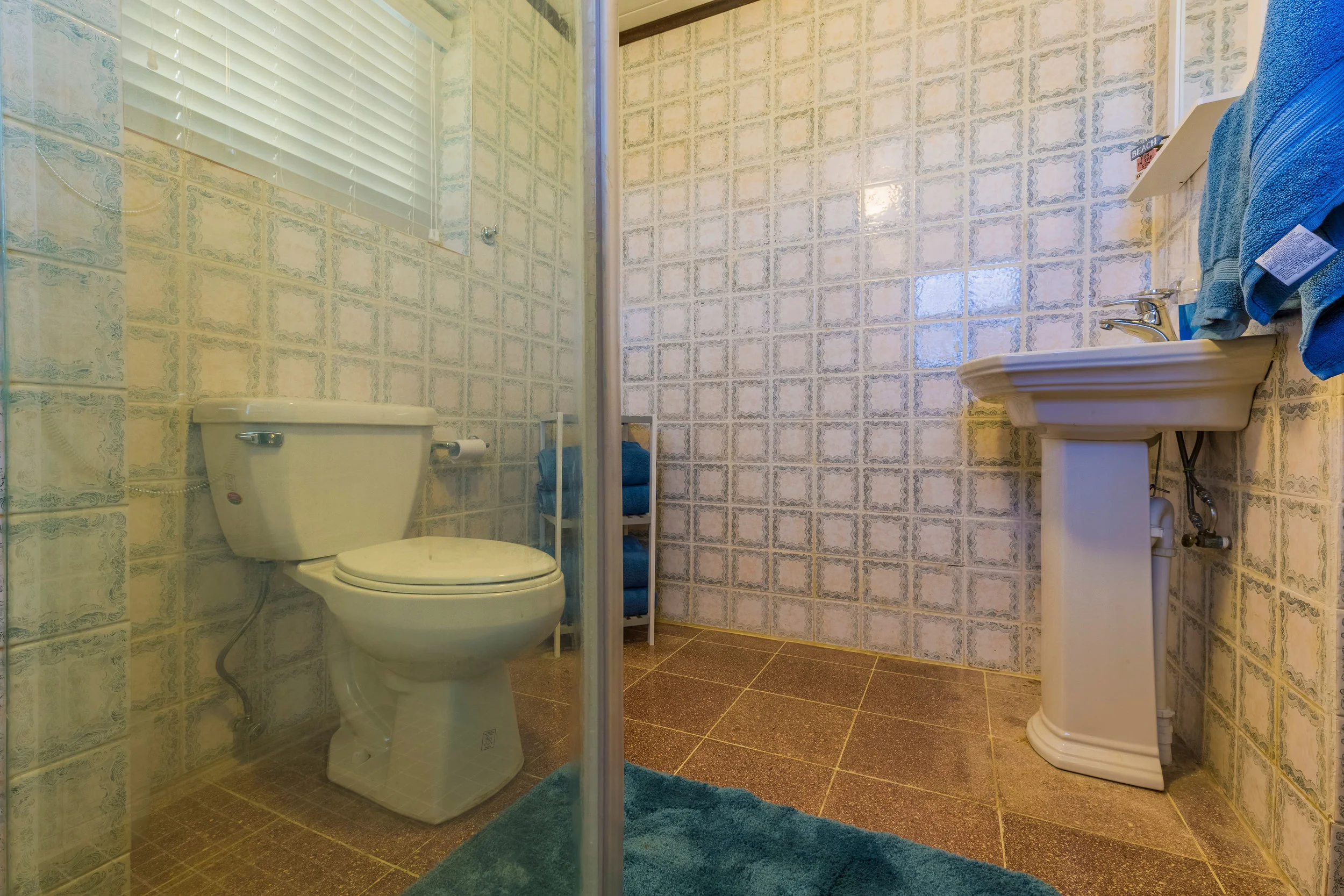 Walk-in shower with tank-less water heater