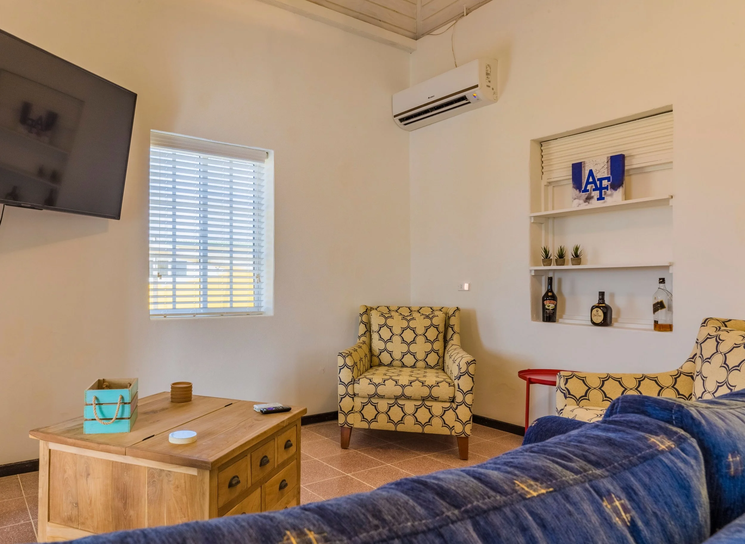 Living room with vaulted ceiling and ceiling fan 