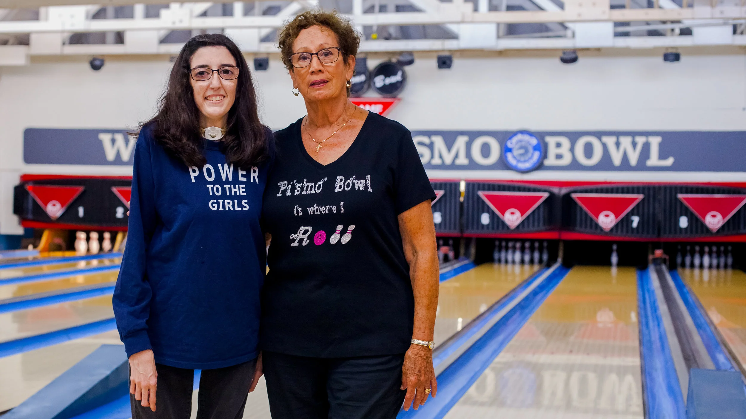 Michele and Anita, both members of the Tuesday Night Mixed League at Pismo Bowl with some serious shirt game. Pismo Bowl, California