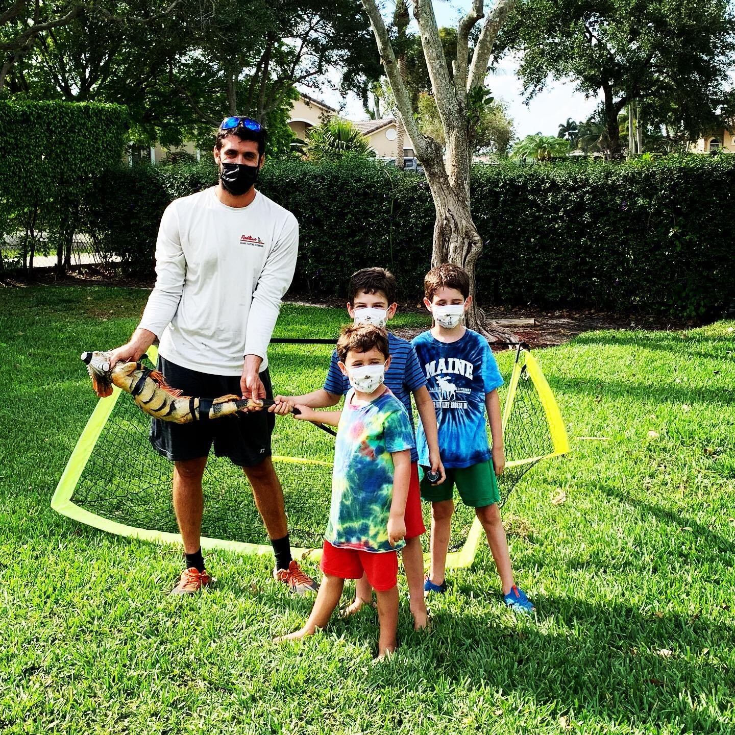 These kids were playing soccer and out of no where this large iguana ran over and got stuck in their net! Blake removed the animal, secured it with tape (for the kids protection), and used this moment to educate them on iguanas!  Although iguanas are