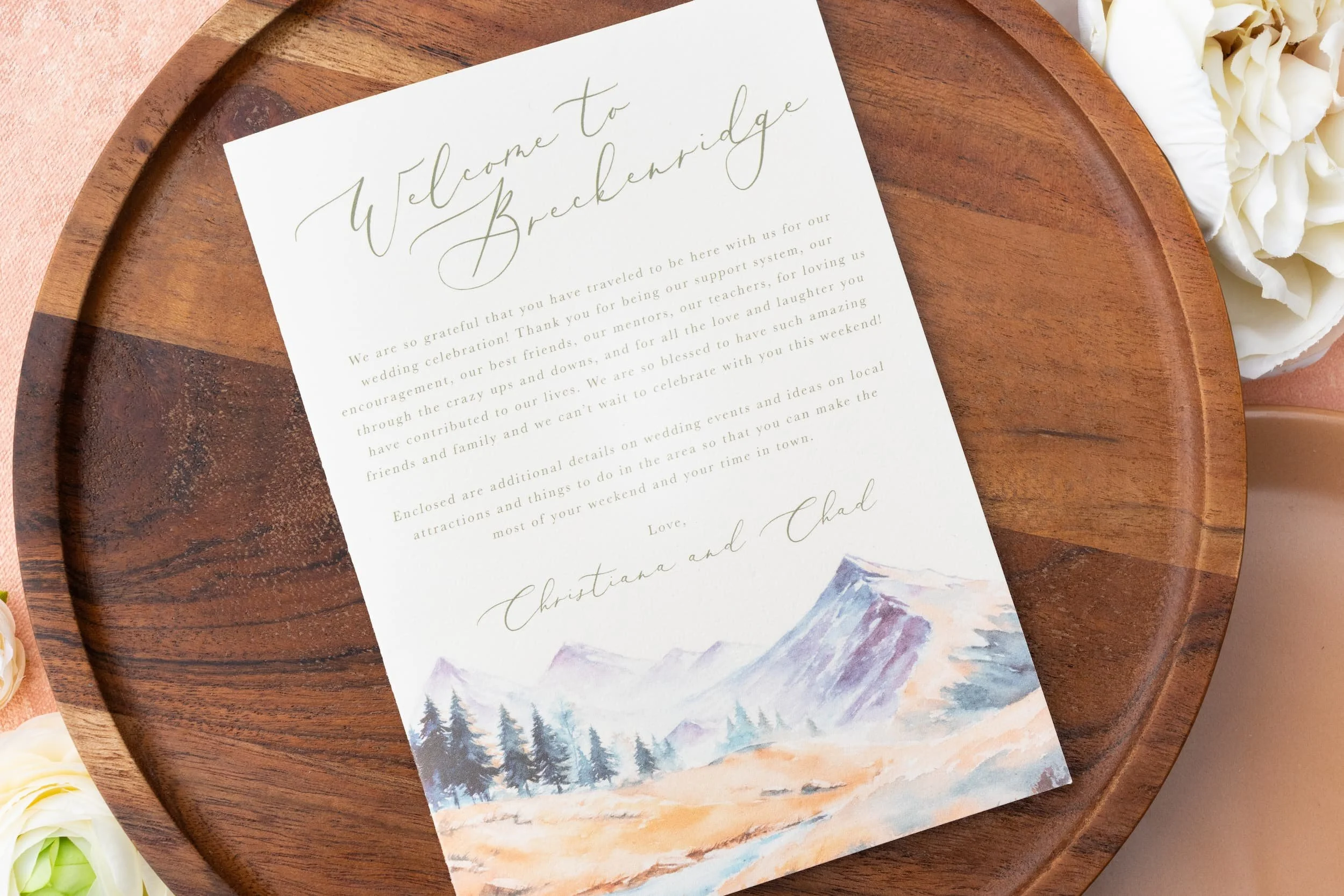 Welcome letter outlining a weekend of wedding festivities with watercolor mountain artwork, elegant typography, and luxury ranch-inspired styling.