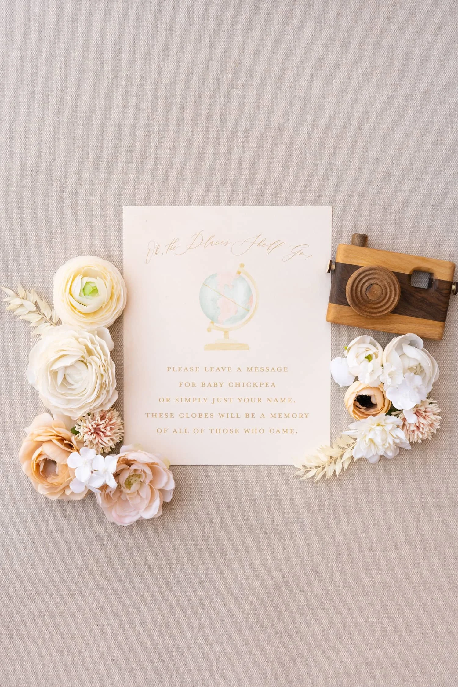 Baby shower details card featuring coordinating peach and sage watercolor artwork with information about the celebration, travel-inspired design elements, and modern typography.