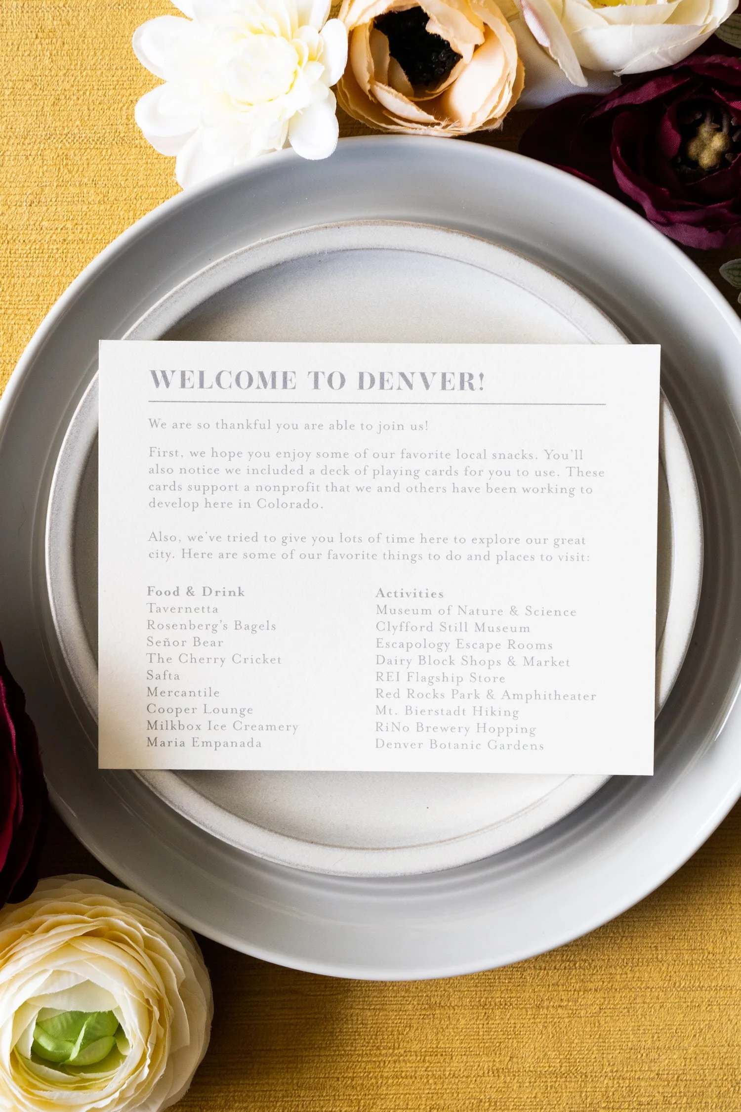 Luxury letterpress and foil wedding invitation suite for a September wedding at Kimpton Hotel Born featuring gray, harvest gold, burgundy, and black-and-white details inspired by the city of Denver.