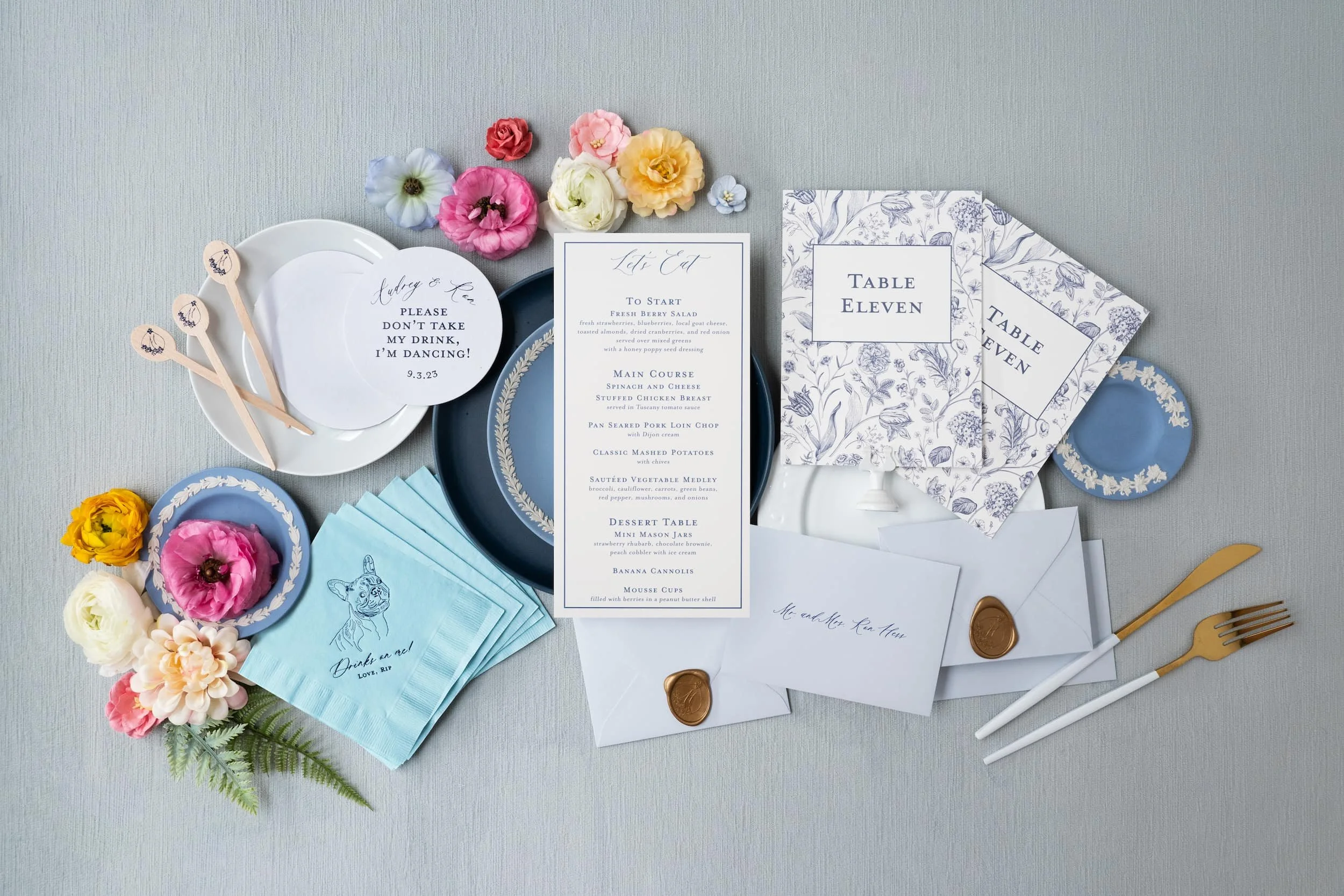 Comprehensive luxury wedding paper story showcasing engagement party invitations, save the dates, wedding invitations, and day-of details with letterpress, blind debossing, edge painting, and custom crest design.