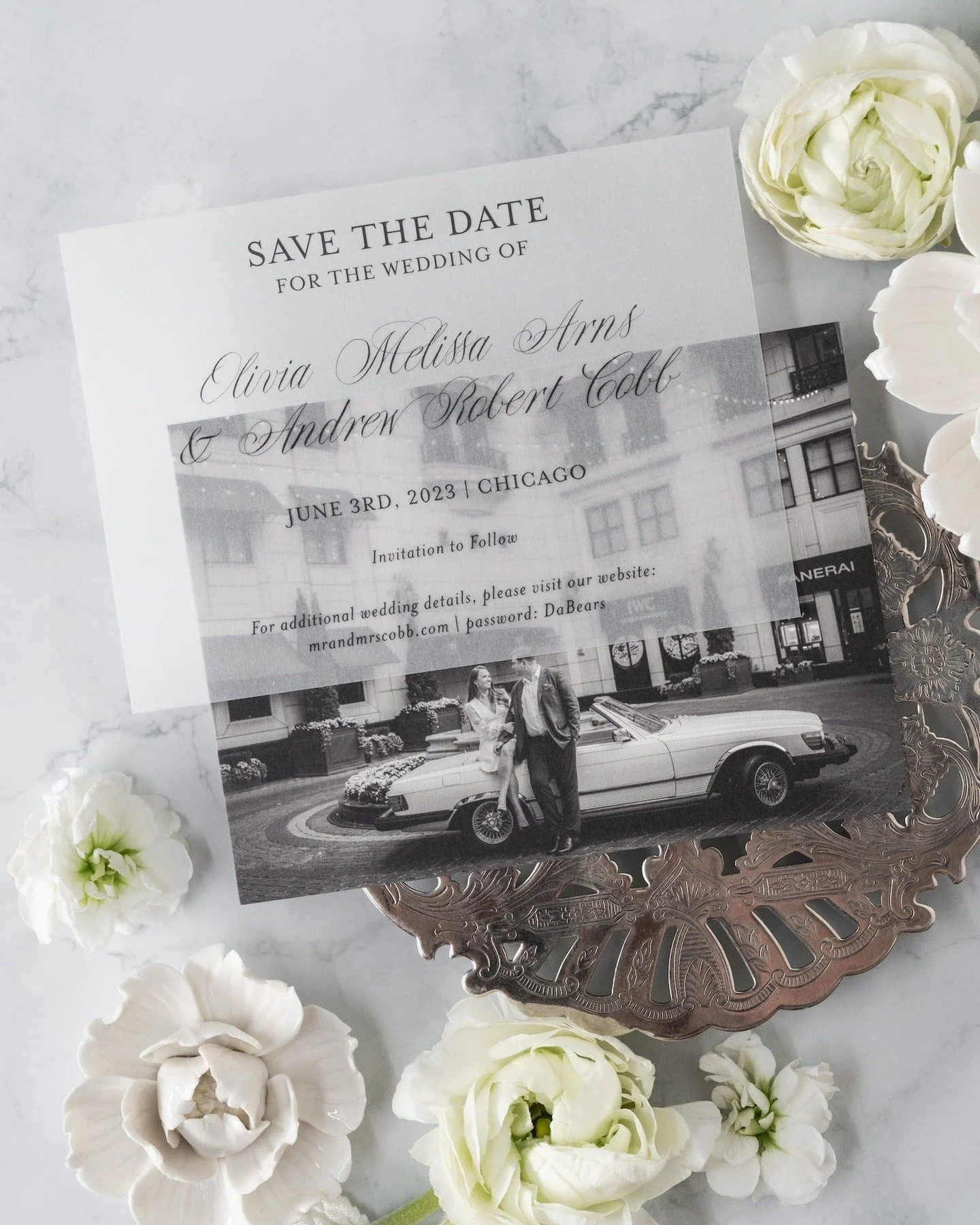 Happy Anniversary to this fabulous Chicago couple!⁣
⁣
Inspired by Old-World Chicago, this custom save the date featured a photograph of the couple in front of the Waldorf Astoria Chicago alongside the bride's father's beloved vintage car&mdash;a deta