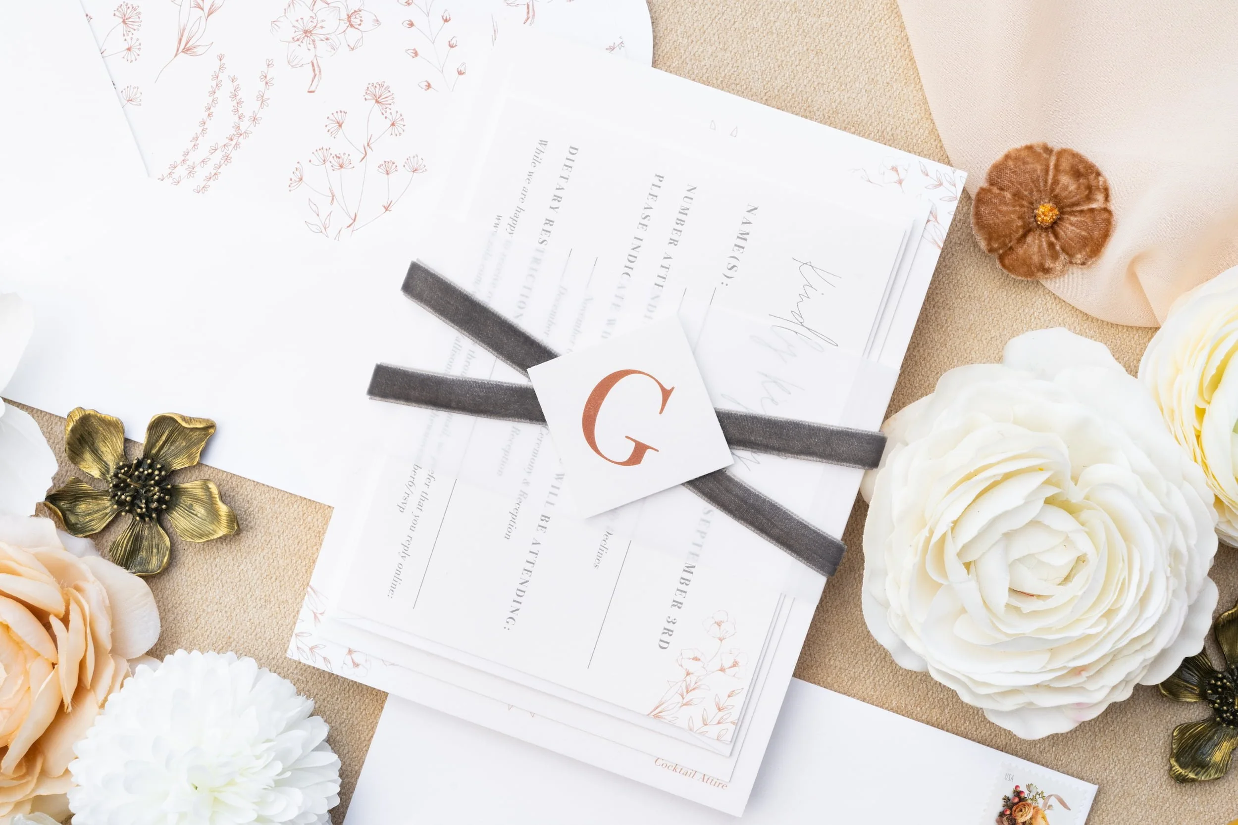 Elegant barn wedding stationery suite with velvet details, soft gray paper, rust accents, and cozy November-inspired fall textures.