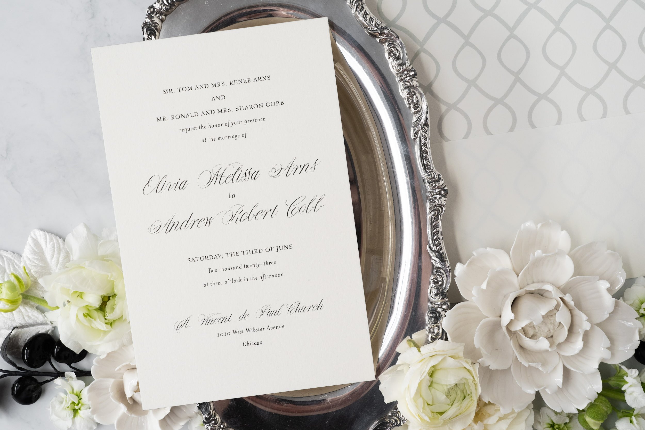 Luxury black-and-white wedding invitation suite with double-thick cotton cardstock, black edge painting, silk ribbon, and vintage postage inspired by old Chicago elegance.