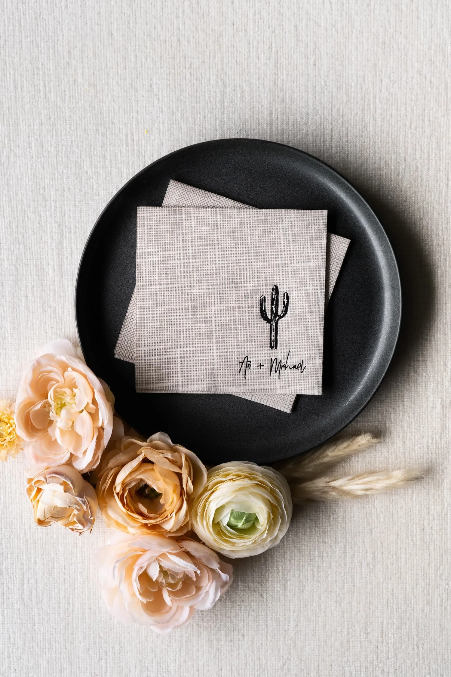 Luxury handmade paper wedding suite and wedding day items with cocktail napkins with letterpress printing and sophisticated desert textures designed for an upscale Scottsdale wedding celebration.