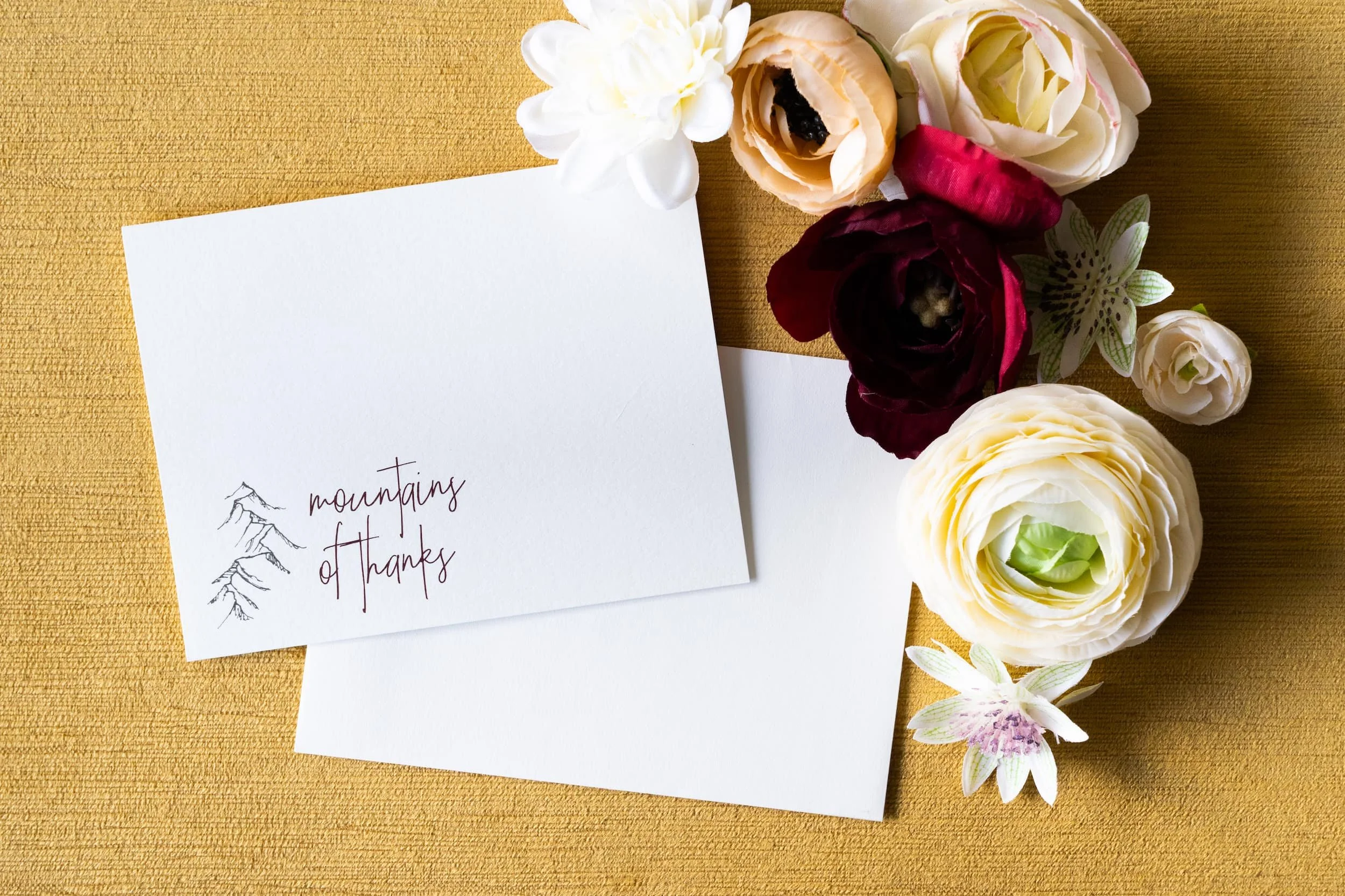 Luxury letterpress and foil wedding invitation suite and thank you cards for a September wedding at Kimpton Hotel Born featuring gray, harvest gold, burgundy, and black-and-white details inspired by the city of Denver.