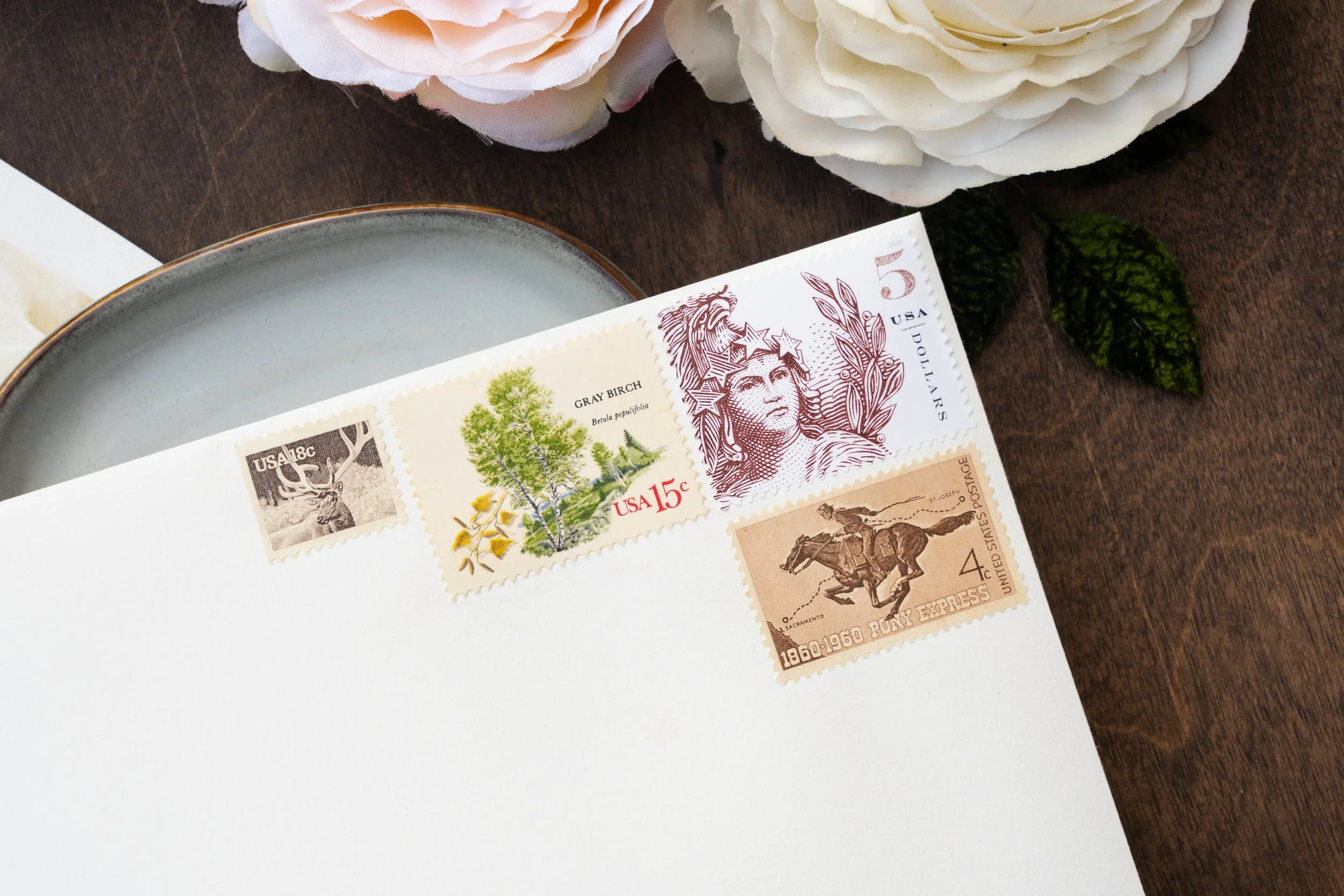 Luxury mountain wedding suite with custom watercolor landscape artwork, blush florals, linen textures, velvet ribbon, and wax seals designed for a romantic Colorado wedding.