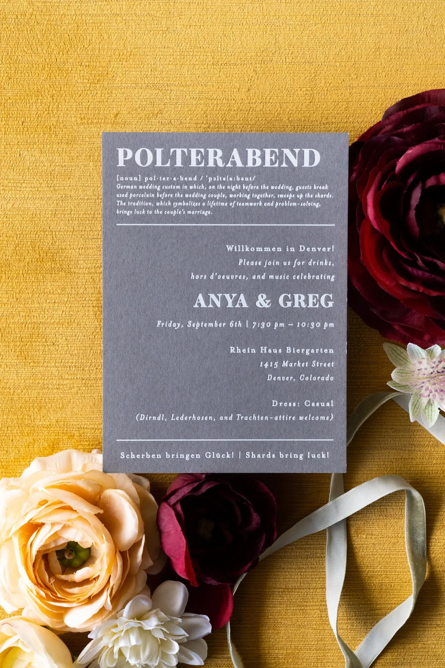 Luxury letterpress and foil wedding invitation suite with German details for a September wedding at Kimpton Hotel Born featuring gray, harvest gold, burgundy, and black-and-white details inspired by the city of Denver.