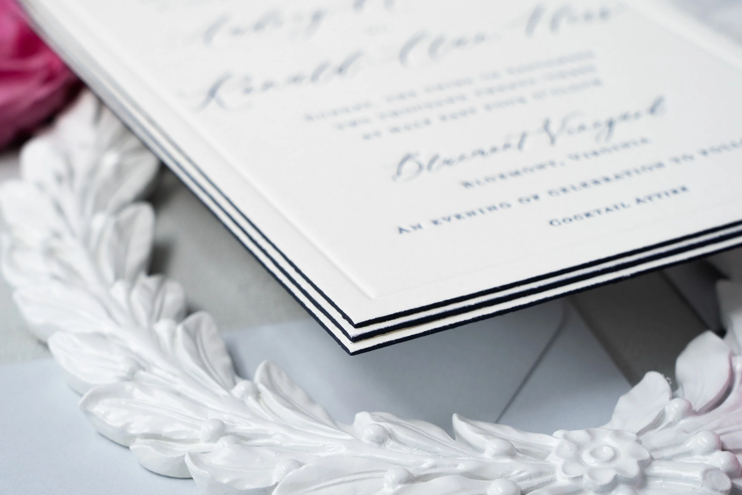 Comprehensive luxury wedding paper story showcasing engagement party invitations, save the dates, wedding invitations, and day-of details with letterpress, blind debossing, edge painting, and custom crest design.