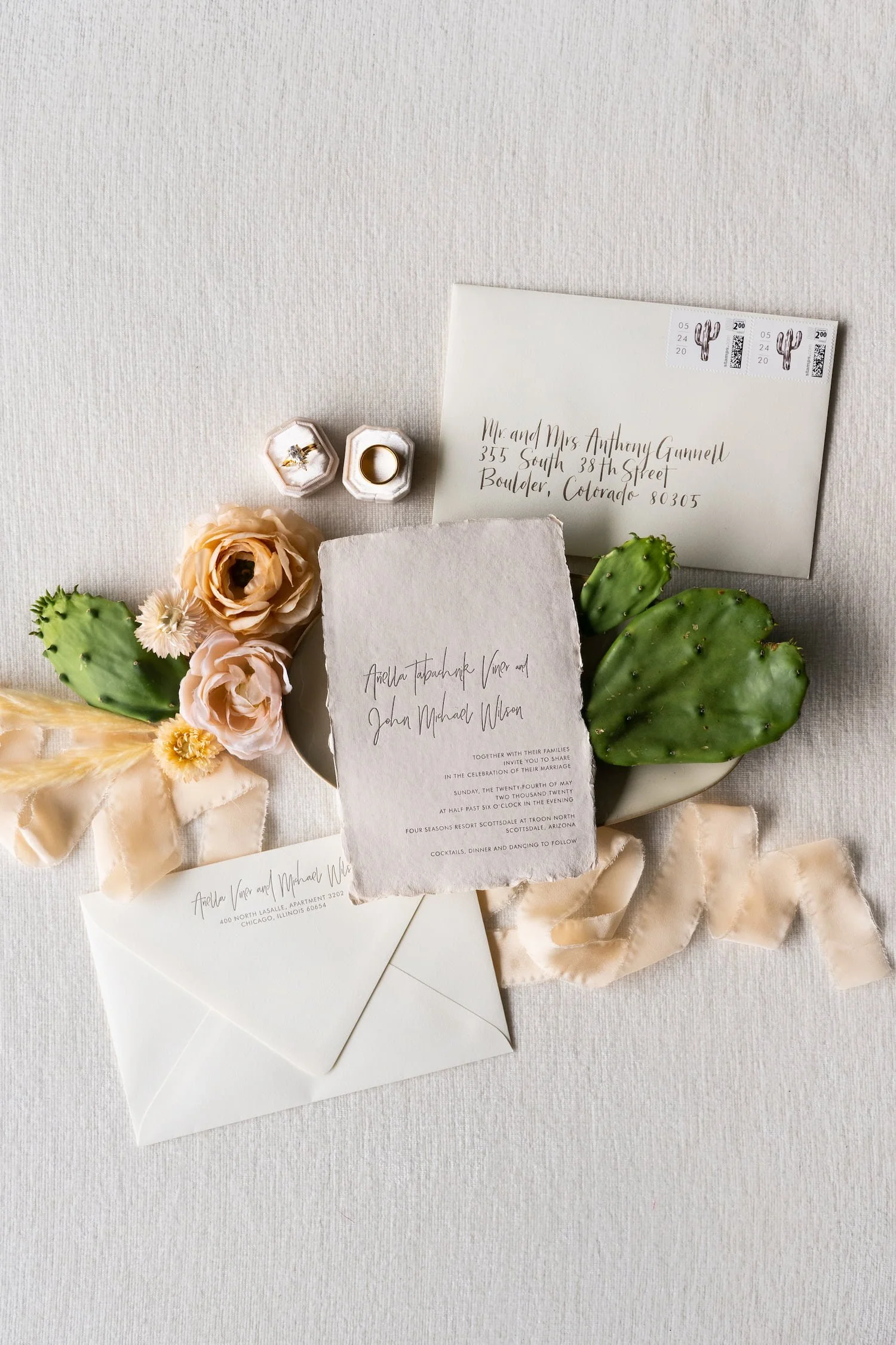 Elegant Scottsdale wedding invitation suite featuring handmade paper, letterpress printing, and refined desert-inspired details for a luxury Four Seasons wedding.