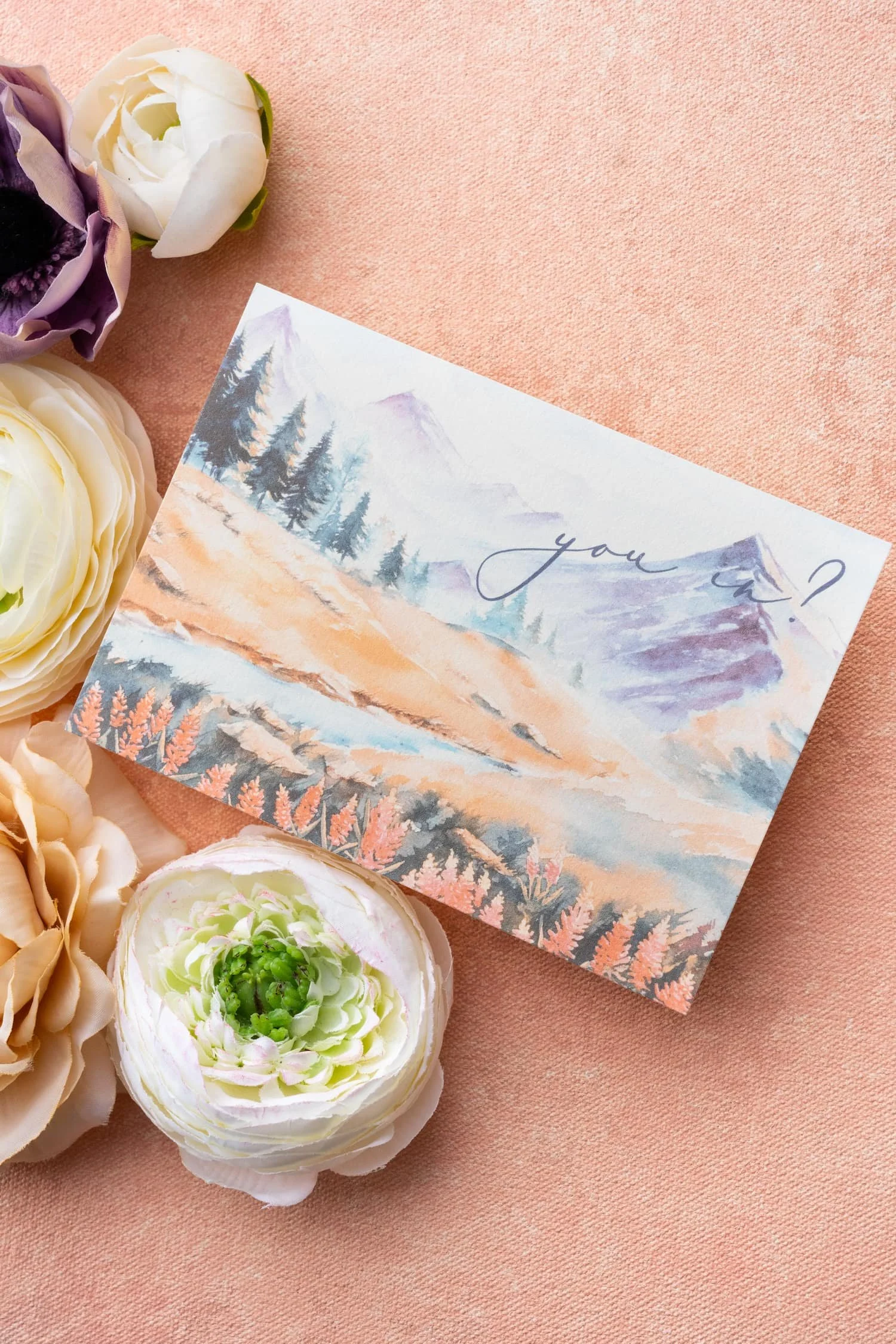 Wedding RSVP card featuring the playful phrase "You in?" in modern script alongside refined typography and watercolor Western-inspired details.