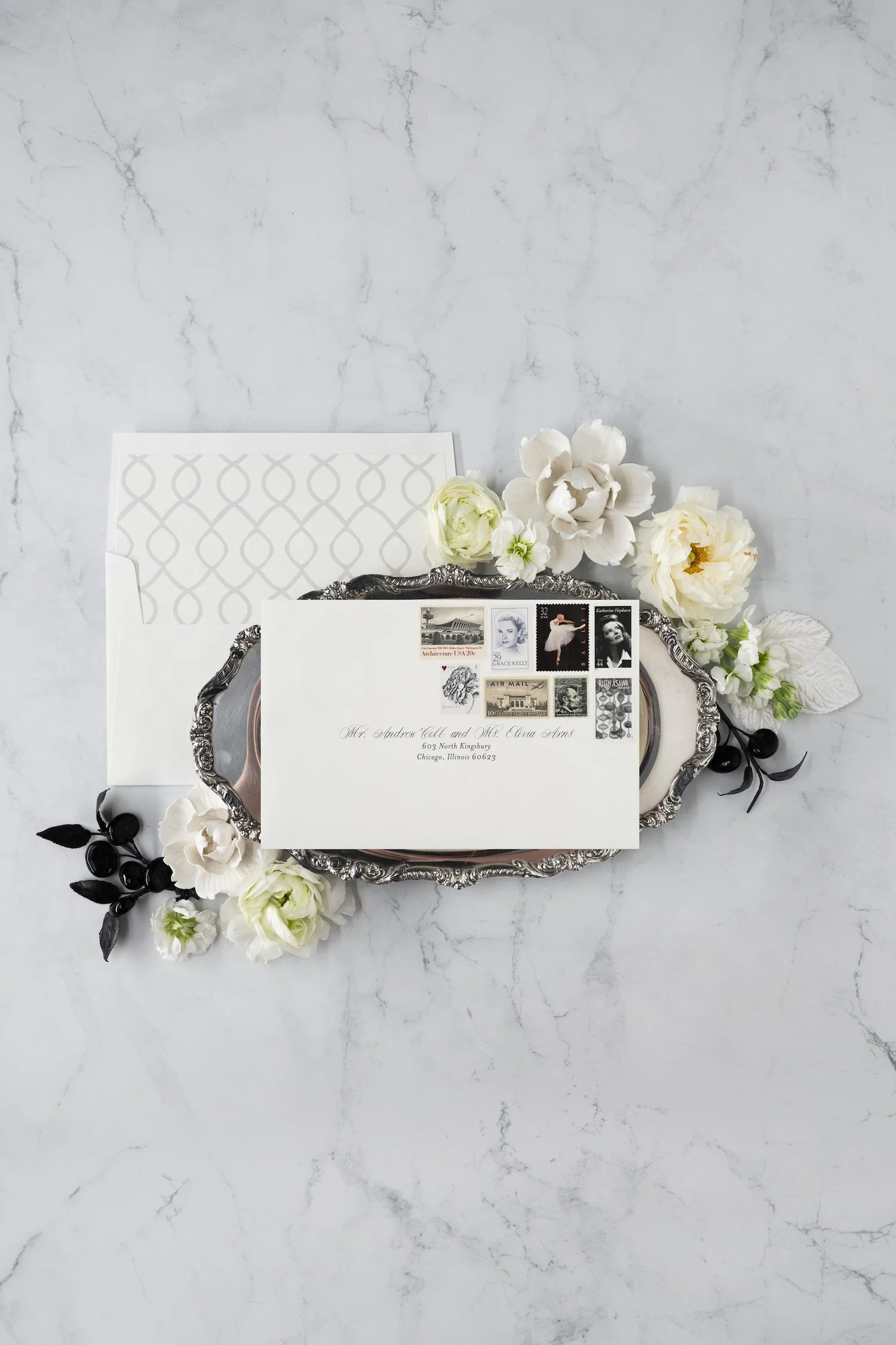 Luxury black-and-white wedding invitation suite with double-thick cotton cardstock, black edge painting, silk ribbon, and vintage postage inspired by old Chicago elegance.