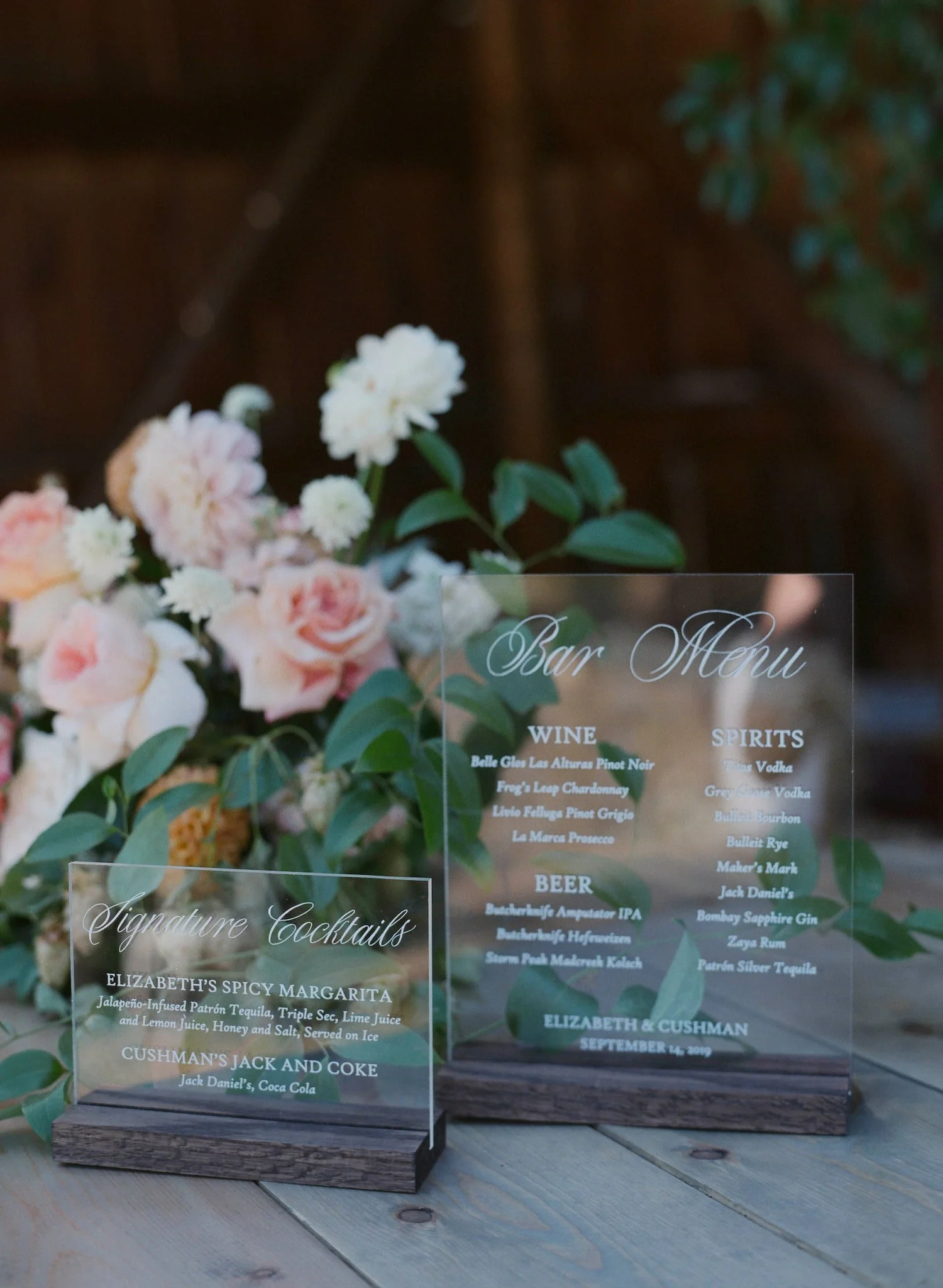 Custom signature cocktail signs featuring elegant typography and coordinating wedding branding for a private residence celebration.