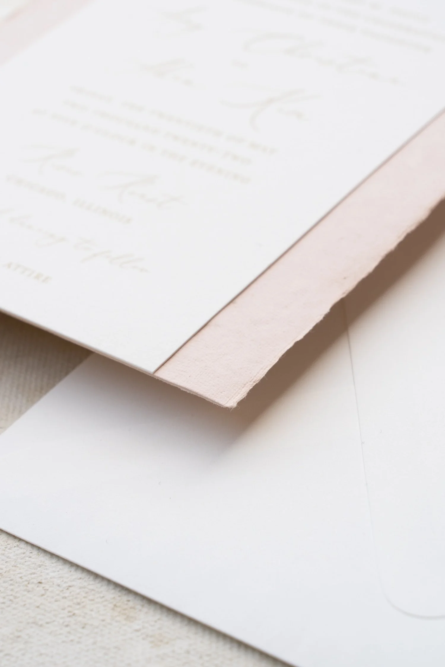 Elegant Chicago wedding invitation suite featuring soft blush and ivory tones, gold foil accents, hand-sewn lace details, and refined nods to both Korean and American traditions.