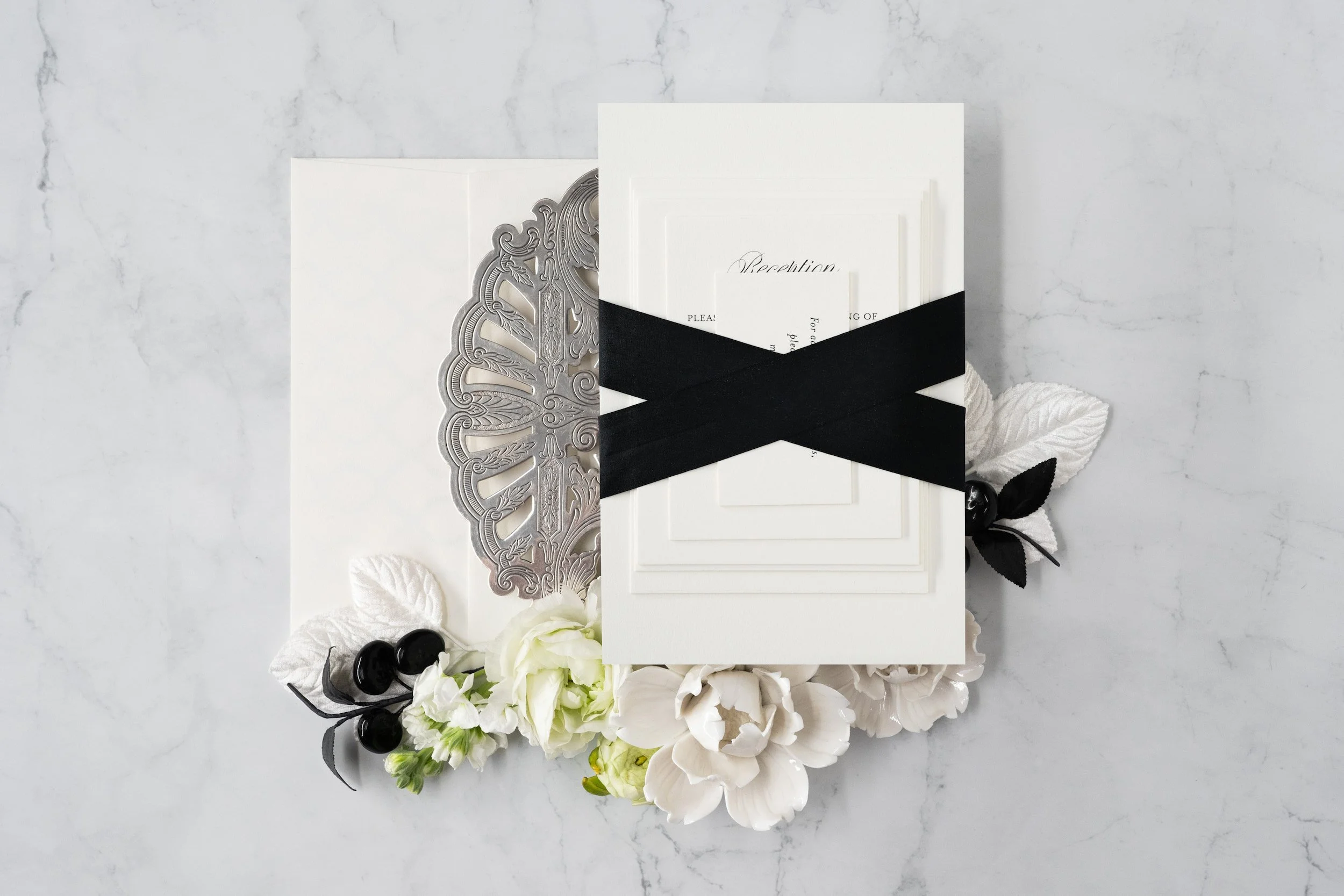 Luxury black-and-white wedding invitation suite with double-thick cotton cardstock, black edge painting, silk ribbon, and vintage postage inspired by old Chicago elegance.