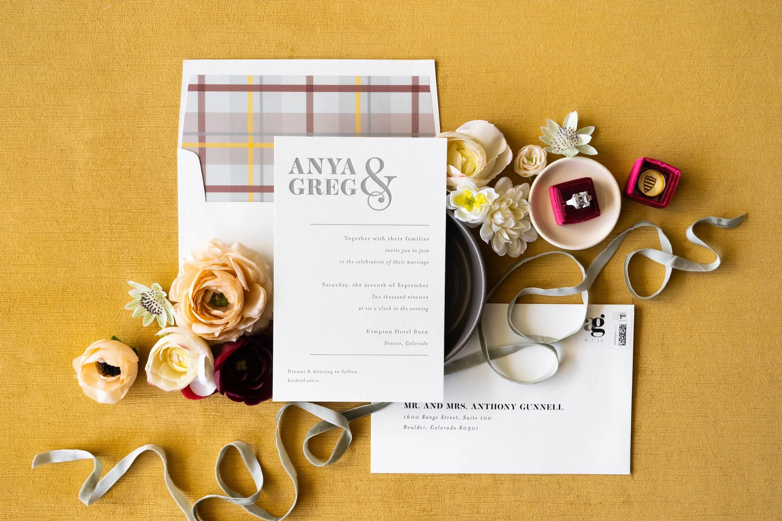 Luxury letterpress and foil wedding invitation suite for a September wedding at Kimpton Hotel Born featuring gray, harvest gold, burgundy, and black-and-white details inspired by the city of Denver.
