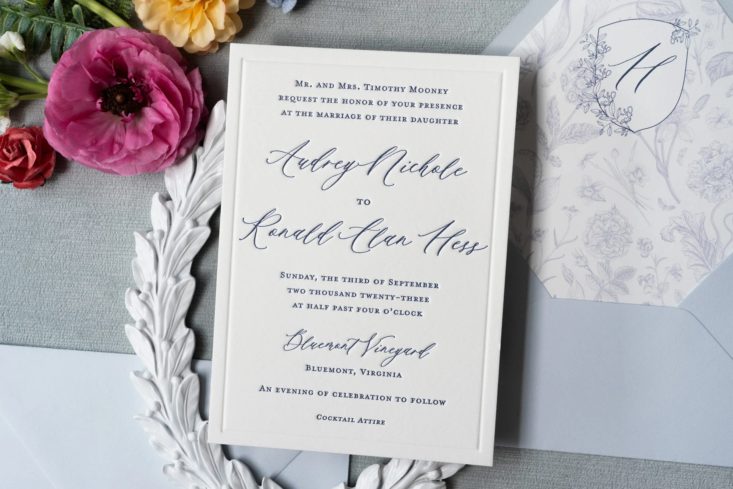 Sophisticated wedding invitation suite and event stationery featuring custom wax seals, floral crest illustrations, letterpress printing, and refined details inspired by a romantic Virginia vineyard celebration.