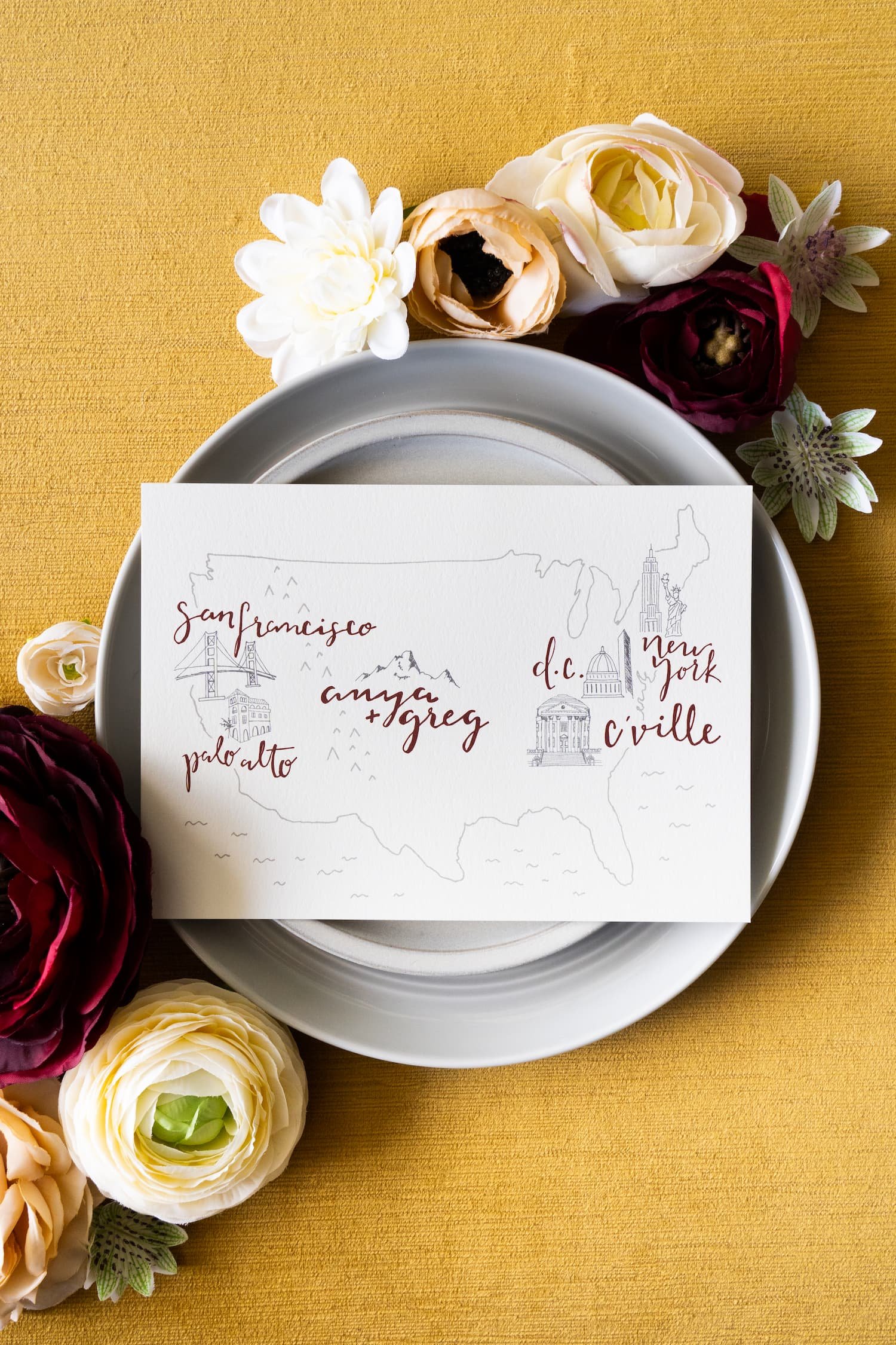 Luxury letterpress and foil wedding invitation suite for a September wedding at Kimpton Hotel Born featuring gray, harvest gold, burgundy, and black-and-white details inspired by the city of Denver.