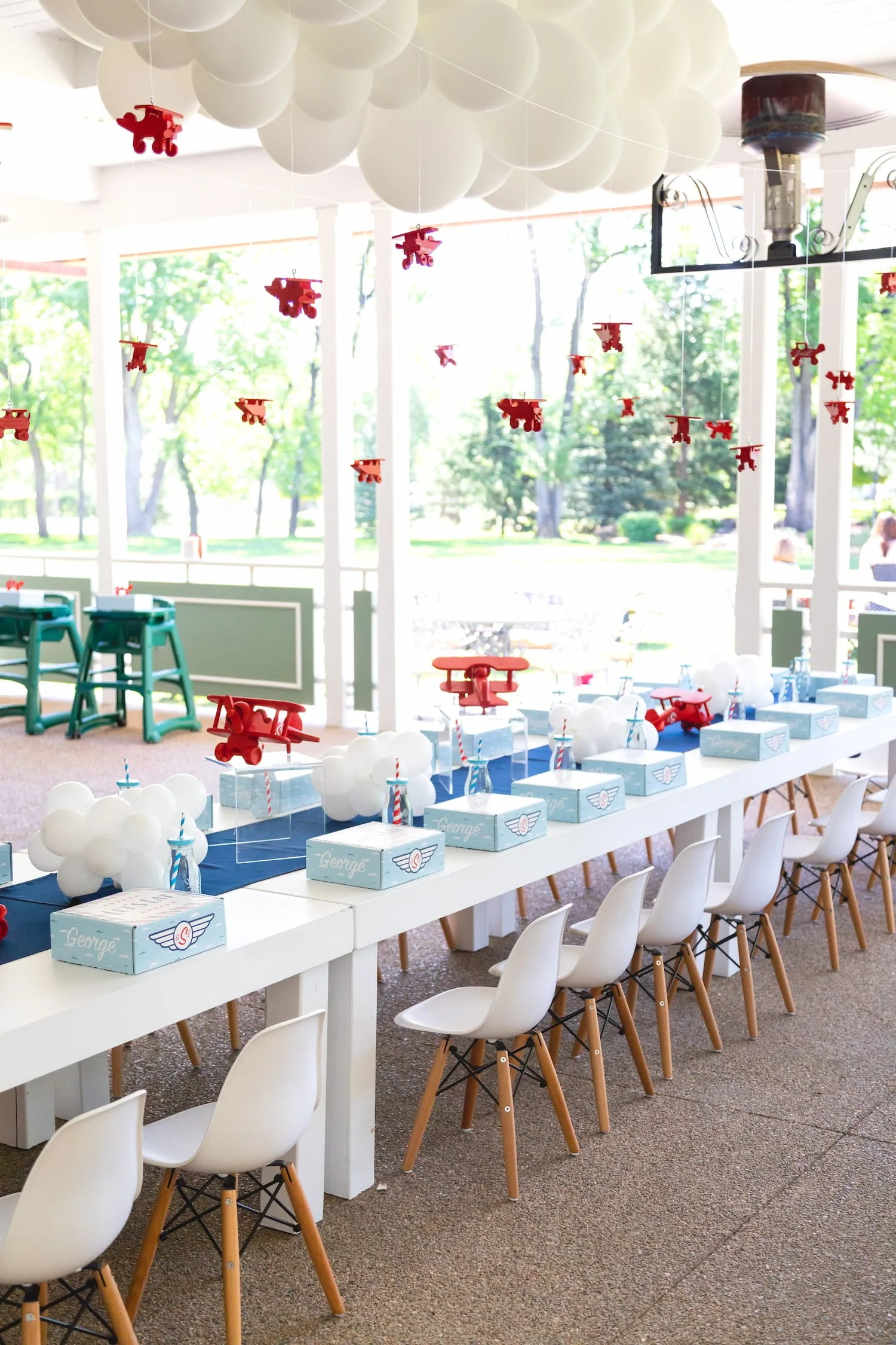 Red, white, and blue airplane birthday party featuring aviation-themed decor, custom signage, and playful details for a two- and four-year-old celebration.