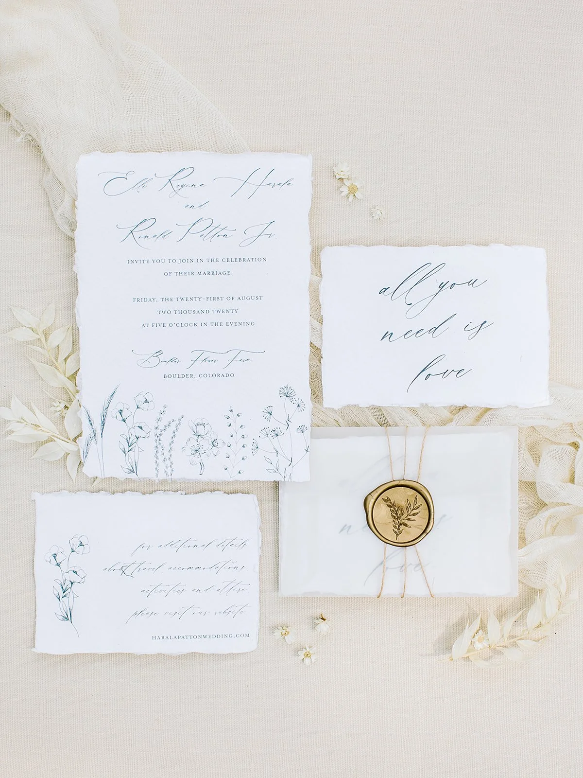 Wildflower-inspired wedding invitation suite for Boulder Flower Farm featuring handmade cotton paper, flowing calligraphy, purple and peach floral illustrations, and butter-yellow accents.