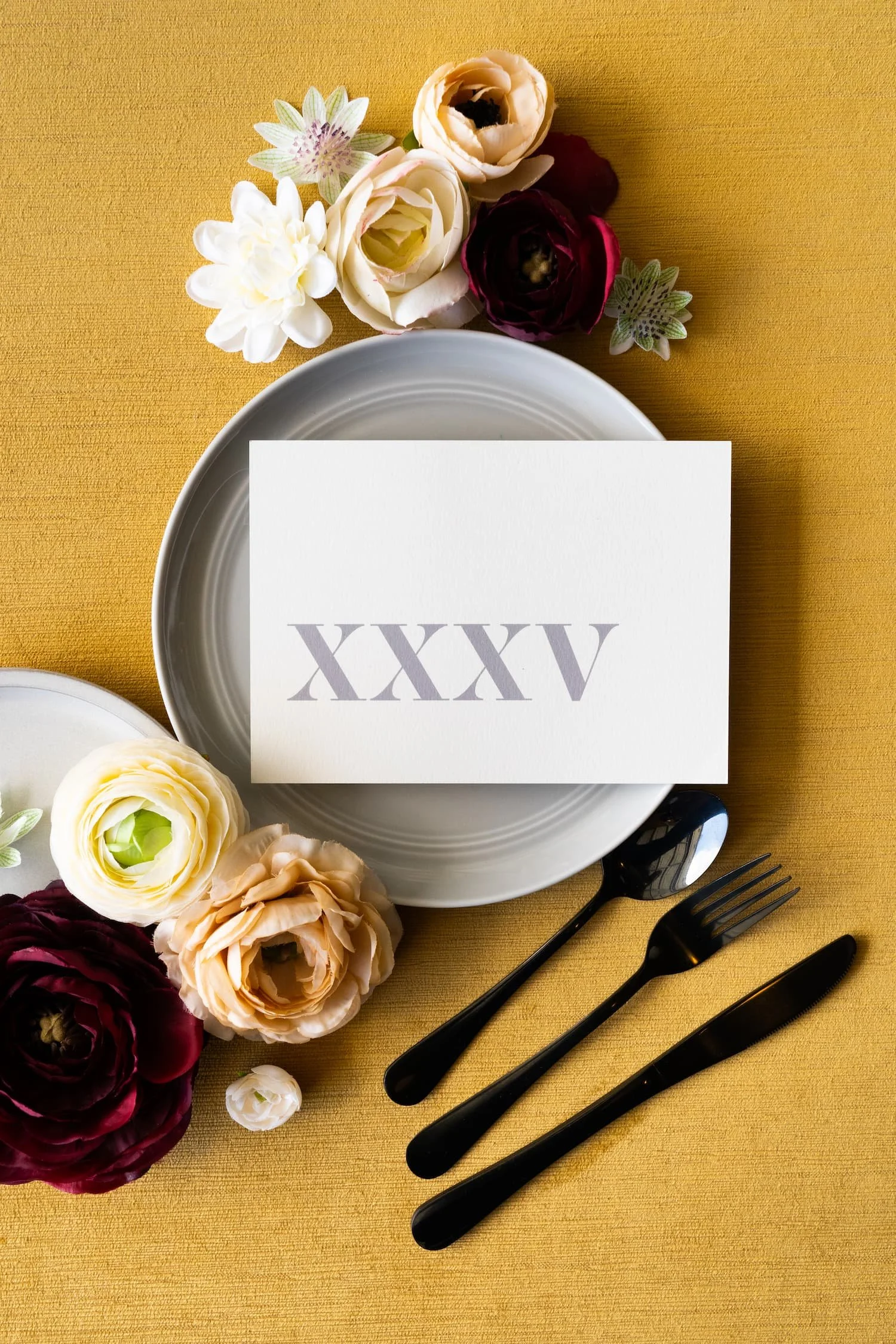 Modern Denver wedding table numbers with bold typography, plaid envelope liner, foil stamping, and custom monogram postage for an autumn celebration.
