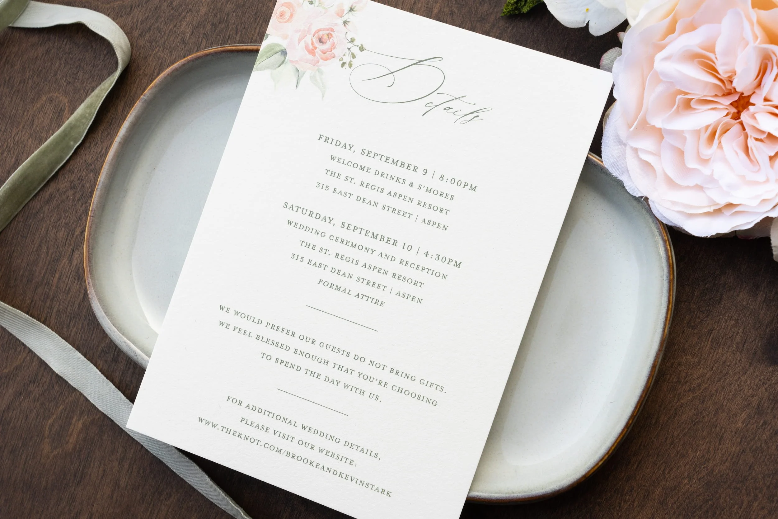 Elegant destination wedding invitation suite featuring watercolor mountain artwork, blush and white flowers, textured paper details, and luxury finishing touches inspired by Aspen, Colorado.