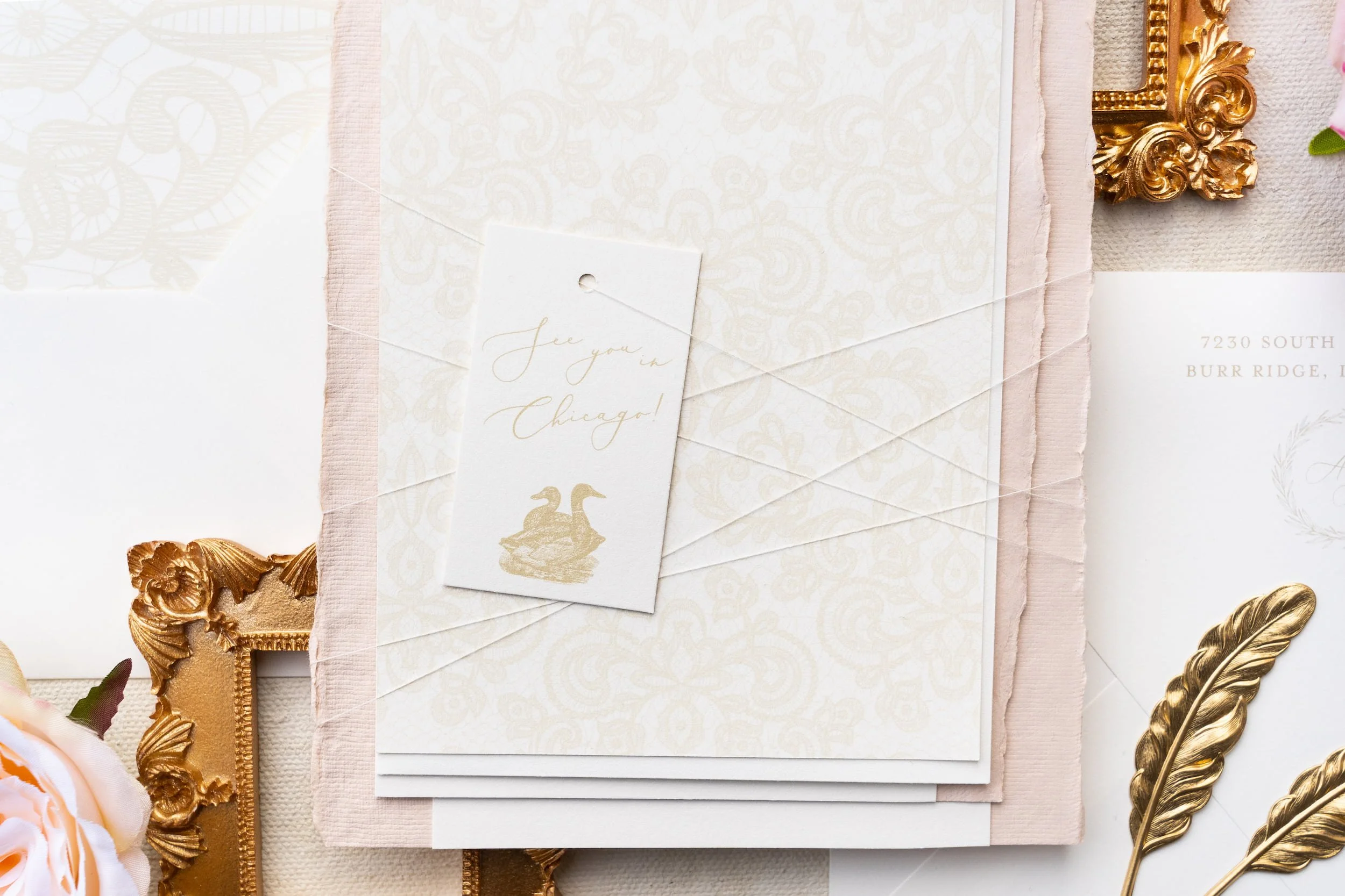 Elegant Chicago wedding invitation suite featuring soft blush and ivory tones, gold foil accents, hand-sewn lace details, and refined nods to both Korean and American traditions.