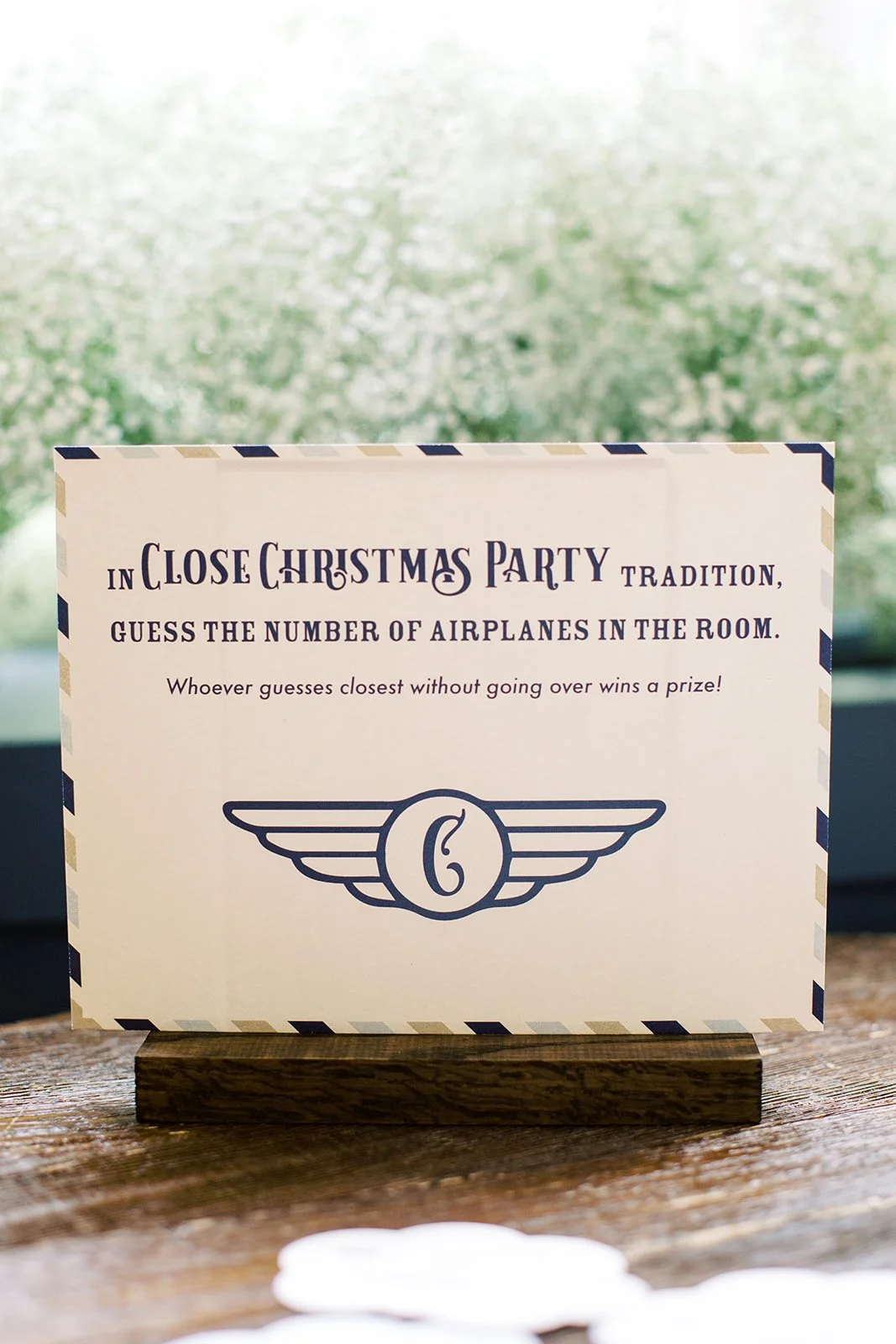 Coordinating travel-themed baby shower signage featuring paper airplane illustrations and modern typography throughout Hotel Teatro in Denver.