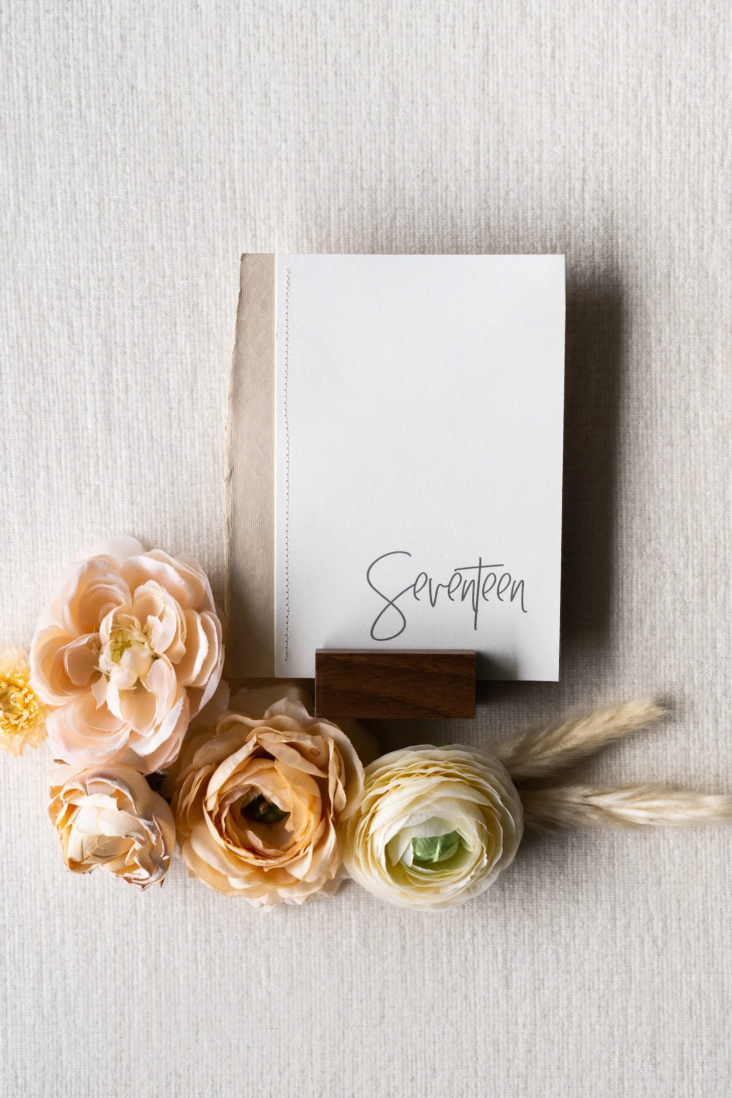 Luxury handmade paper wedding suite and table numbers with letterpress printing and sophisticated desert textures designed for an upscale Scottsdale wedding celebration.
