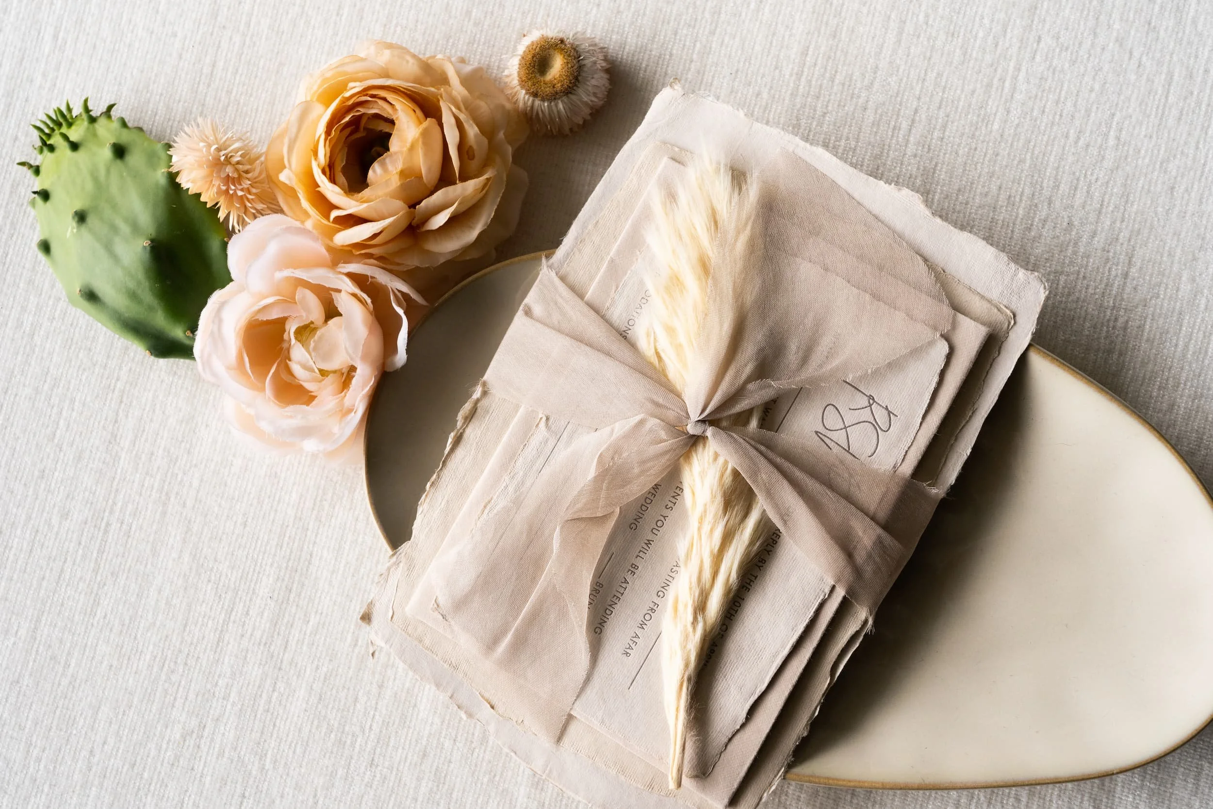 Luxury desert wedding invitation suite letterpressed on handmade paper for a romantic Four Seasons Resort Scottsdale at Troon North celebration inspired by the Arizona landscape.