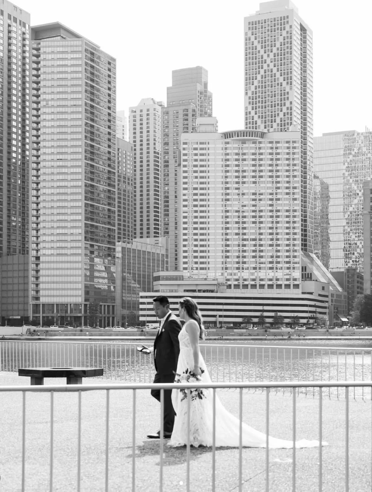Bride and groom on historic riverwalk in Chicago's beautiful downtown.