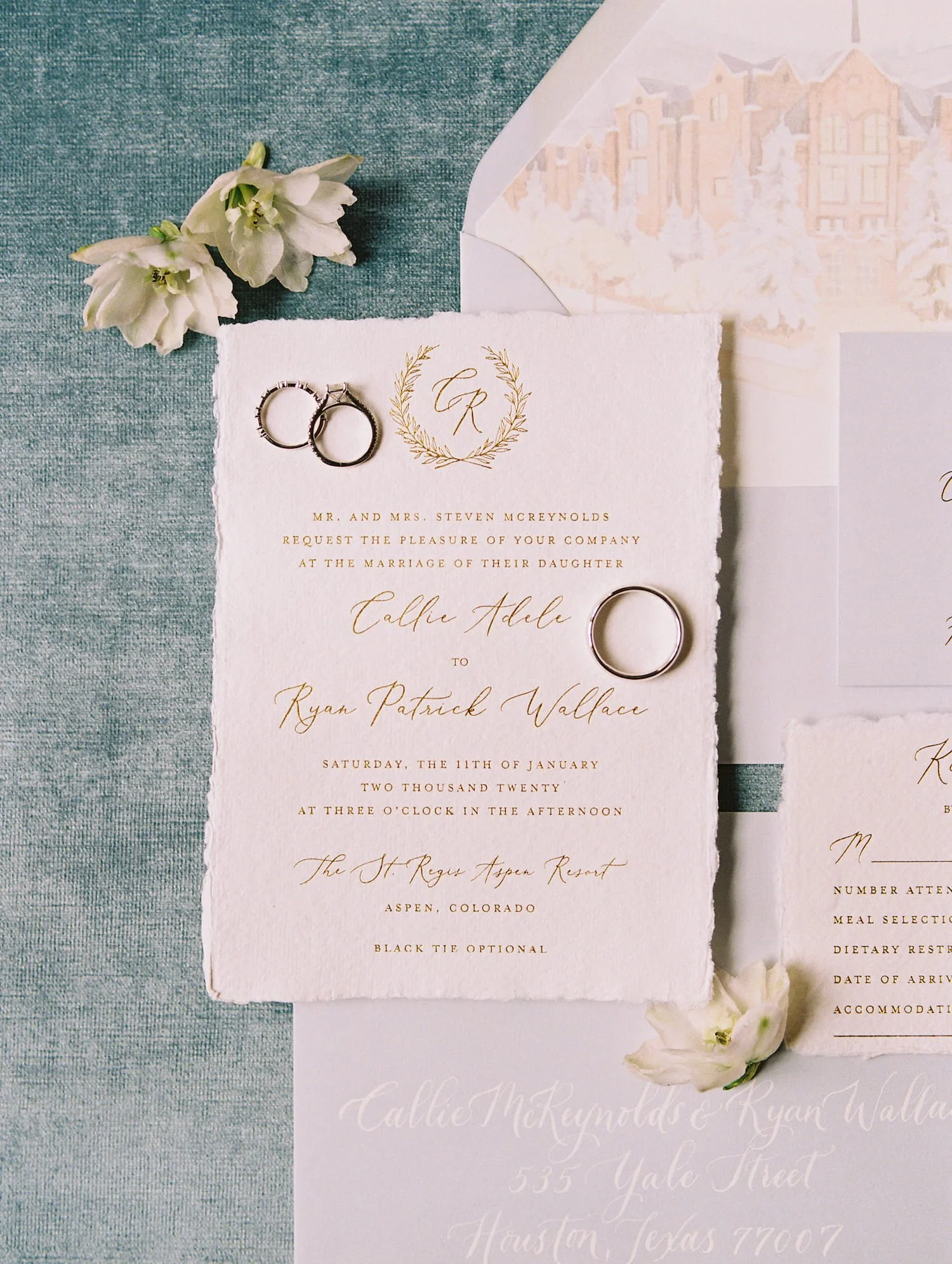 Gold foil wedding invitation printed on handmade cotton paper with steel blue typography, designed for an elegant winter wedding at the St. Regis Aspen.