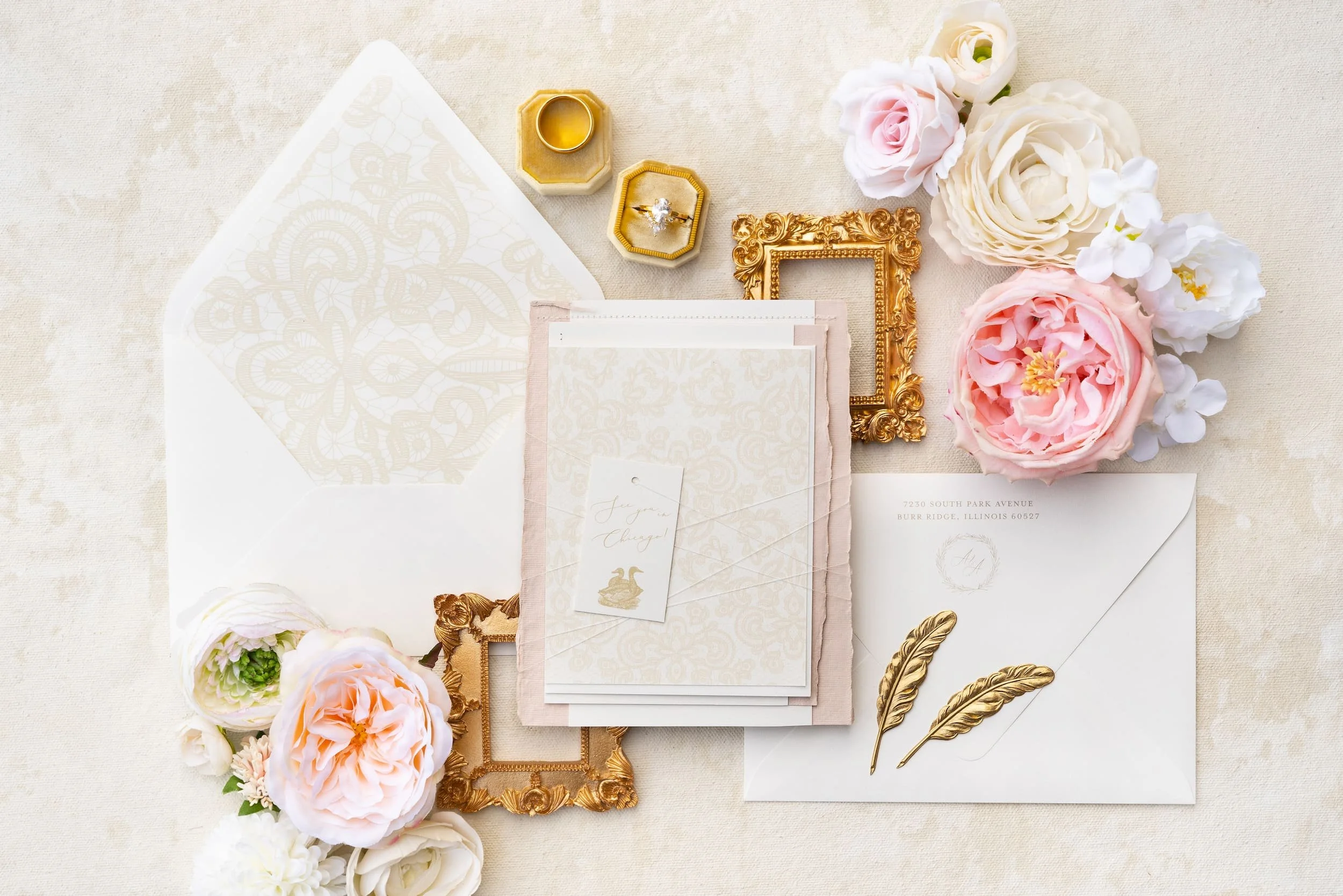 Elegant Chicago wedding invitation suite featuring soft blush and ivory tones, gold foil accents, hand-sewn lace details, and refined nods to both Korean and American traditions.