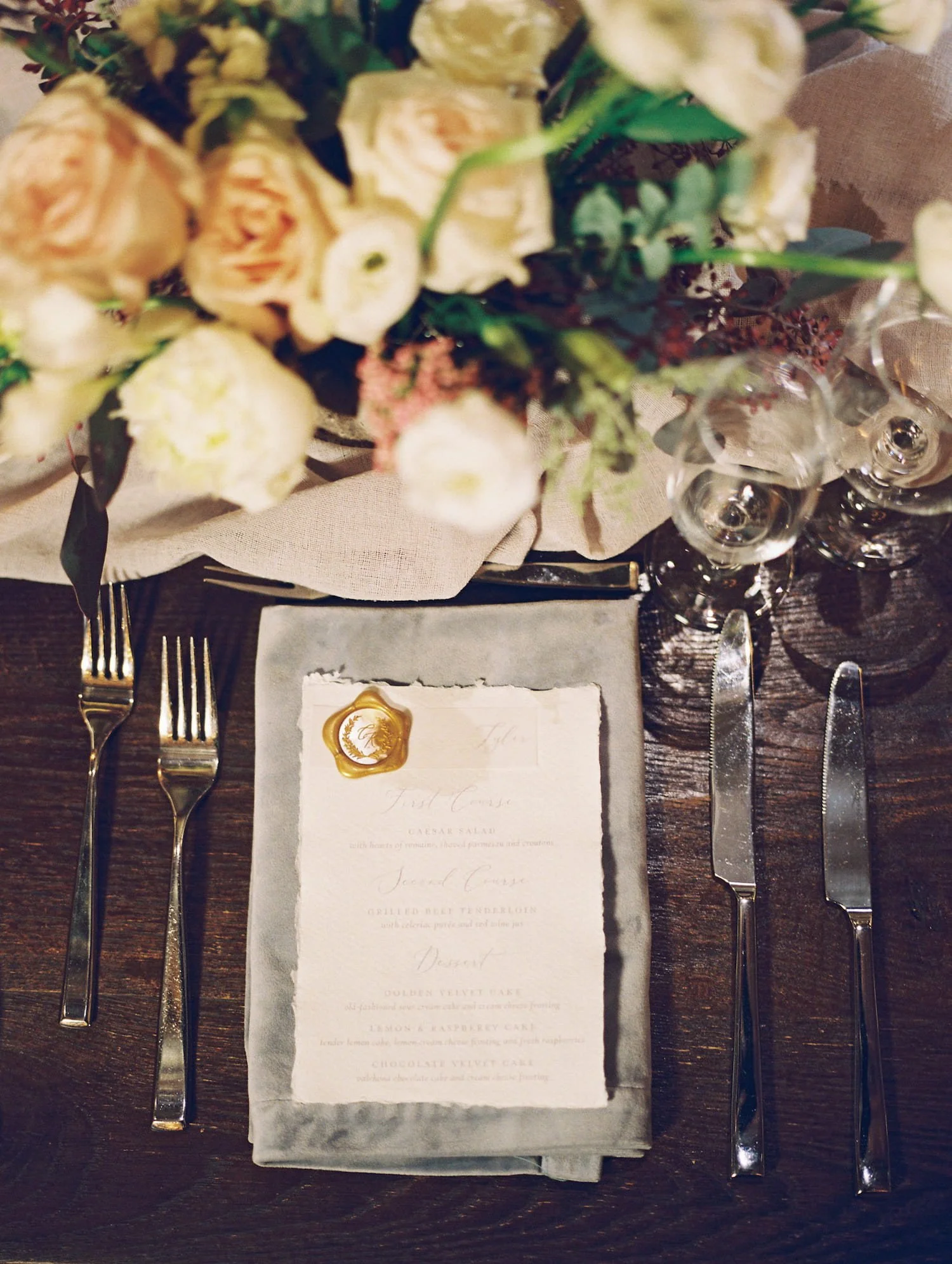 Wedding menus featuring custom wax seals that doubled as meal selections, printed to coordinate with a gold foil Aspen wedding invitation suite.