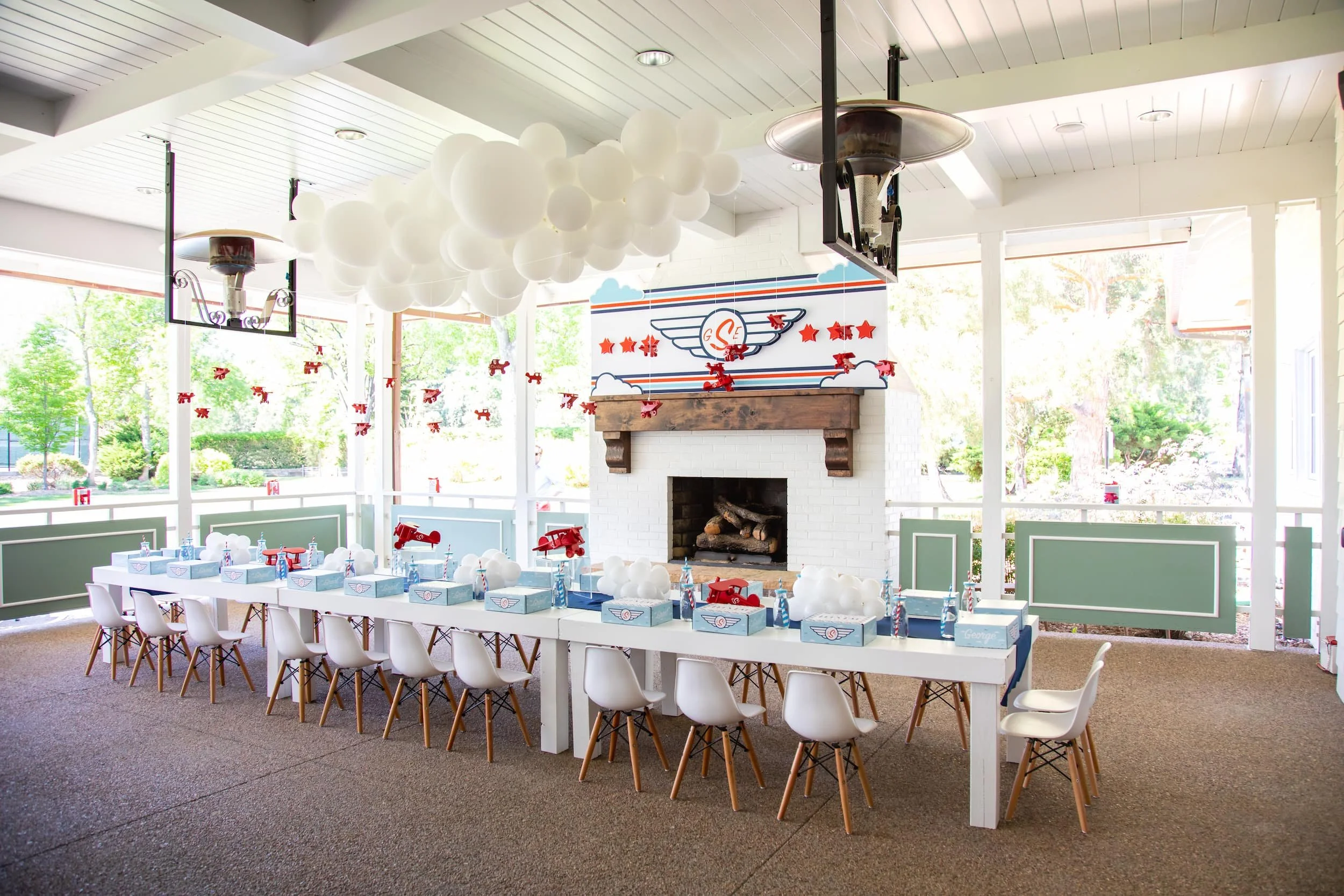 Red, white, and blue airplane birthday party featuring aviation-themed decor, custom signage, and playful details for a two- and four-year-old celebration.