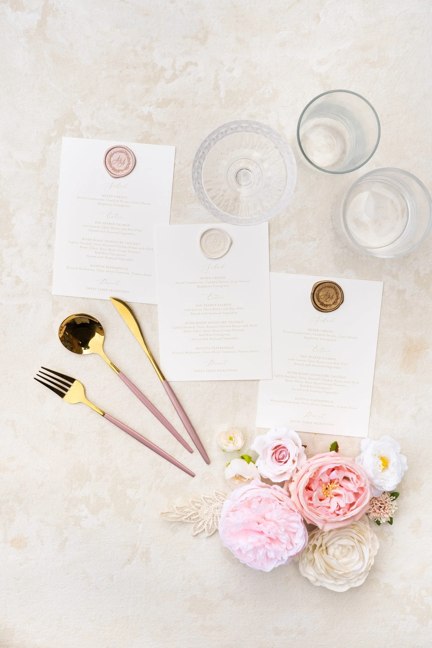 Luxury wedding stationery suite in blush, ivory, and gold with delicate lace accents, hand-sewn embellishments, and romantic details created for a Chicago celebration blending Korean and American heritage.