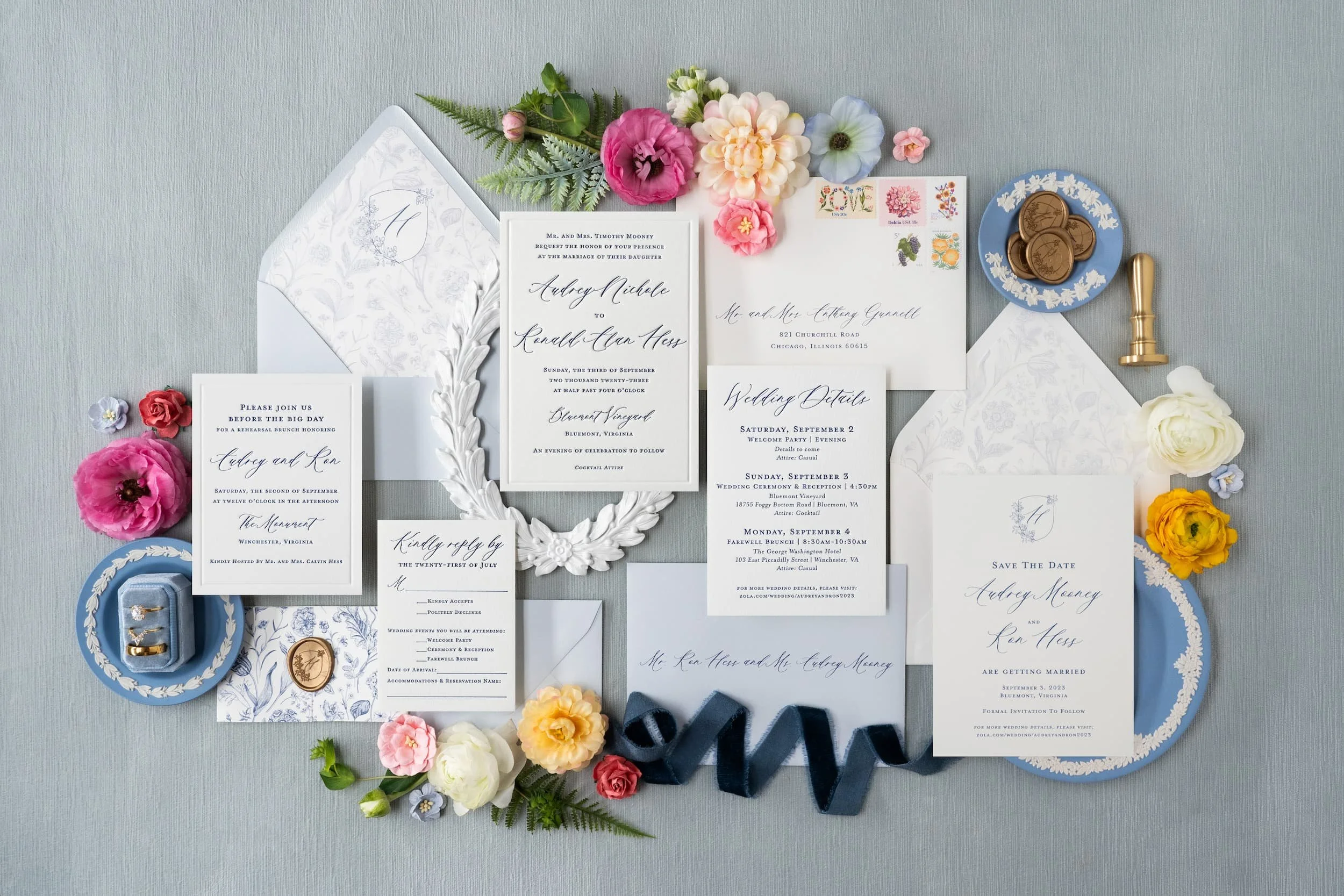 Comprehensive luxury wedding paper story showcasing engagement party invitations, save the dates, wedding invitations, and day-of details with letterpress, blind debossing, edge painting, and custom crest design.