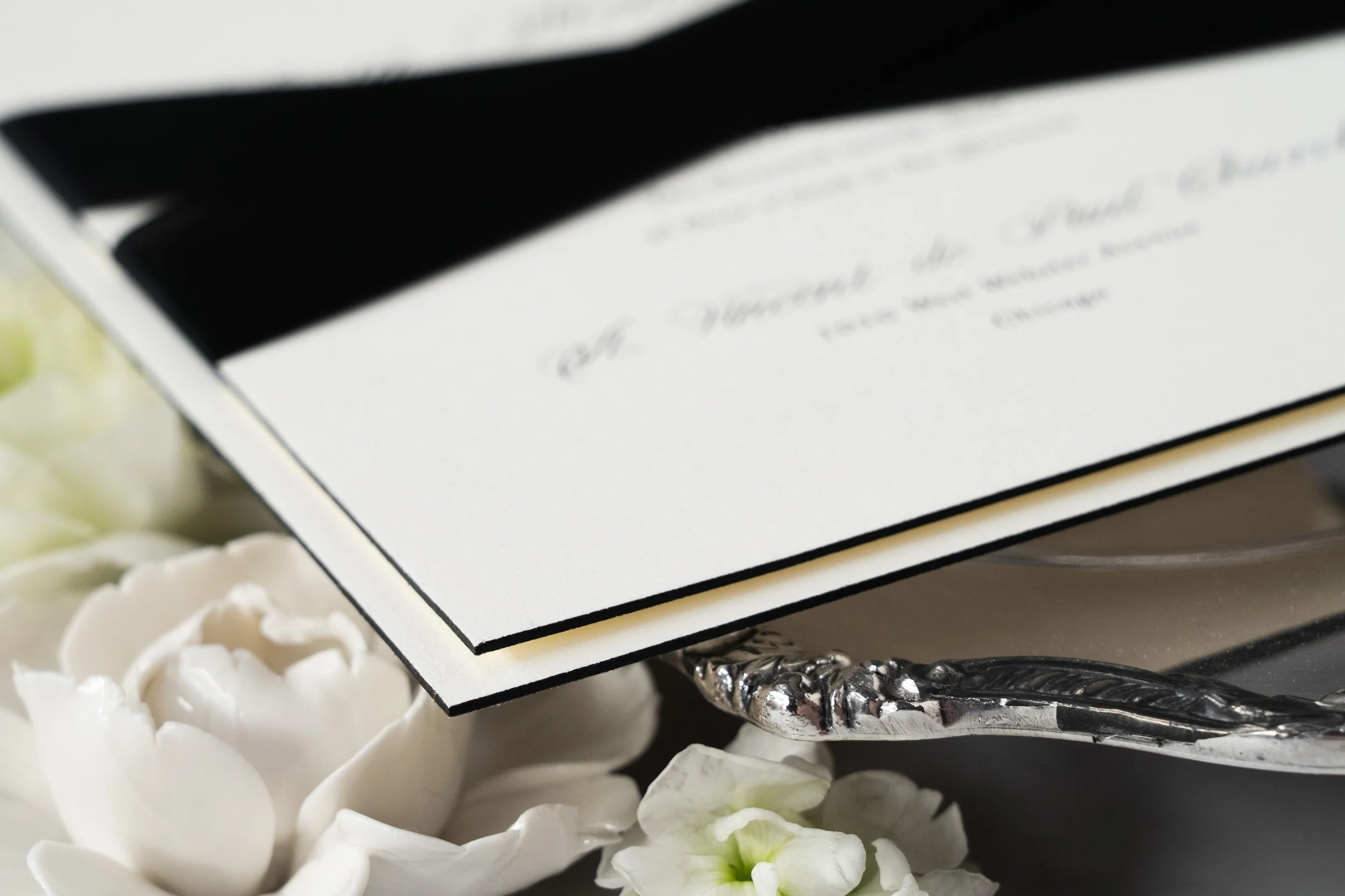 Luxury old-Chicago inspired wedding invitation suite with black edge painting.